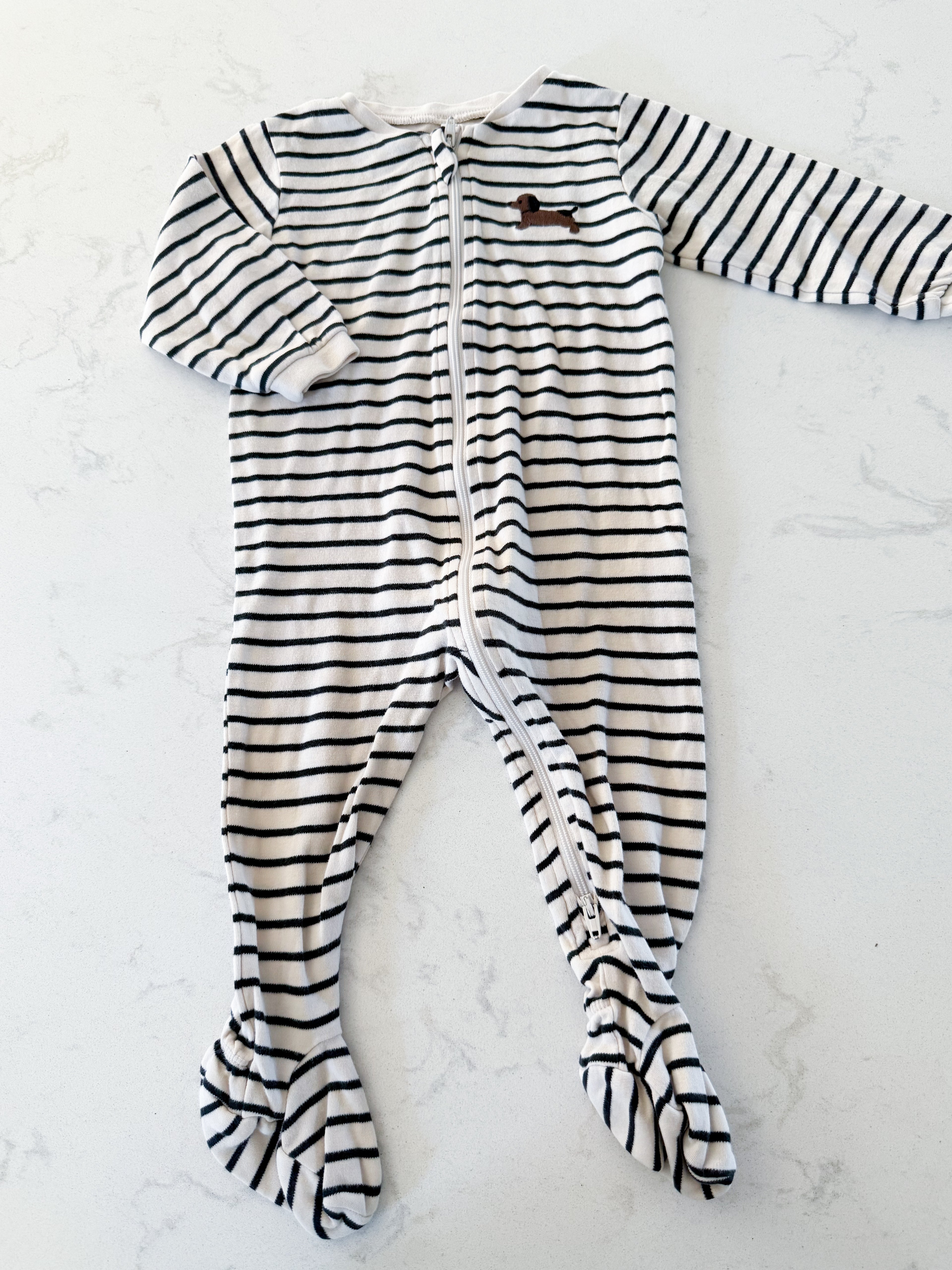 Pekkle- 9m- GUC- cream and black striped footie pajamas with wiener dog