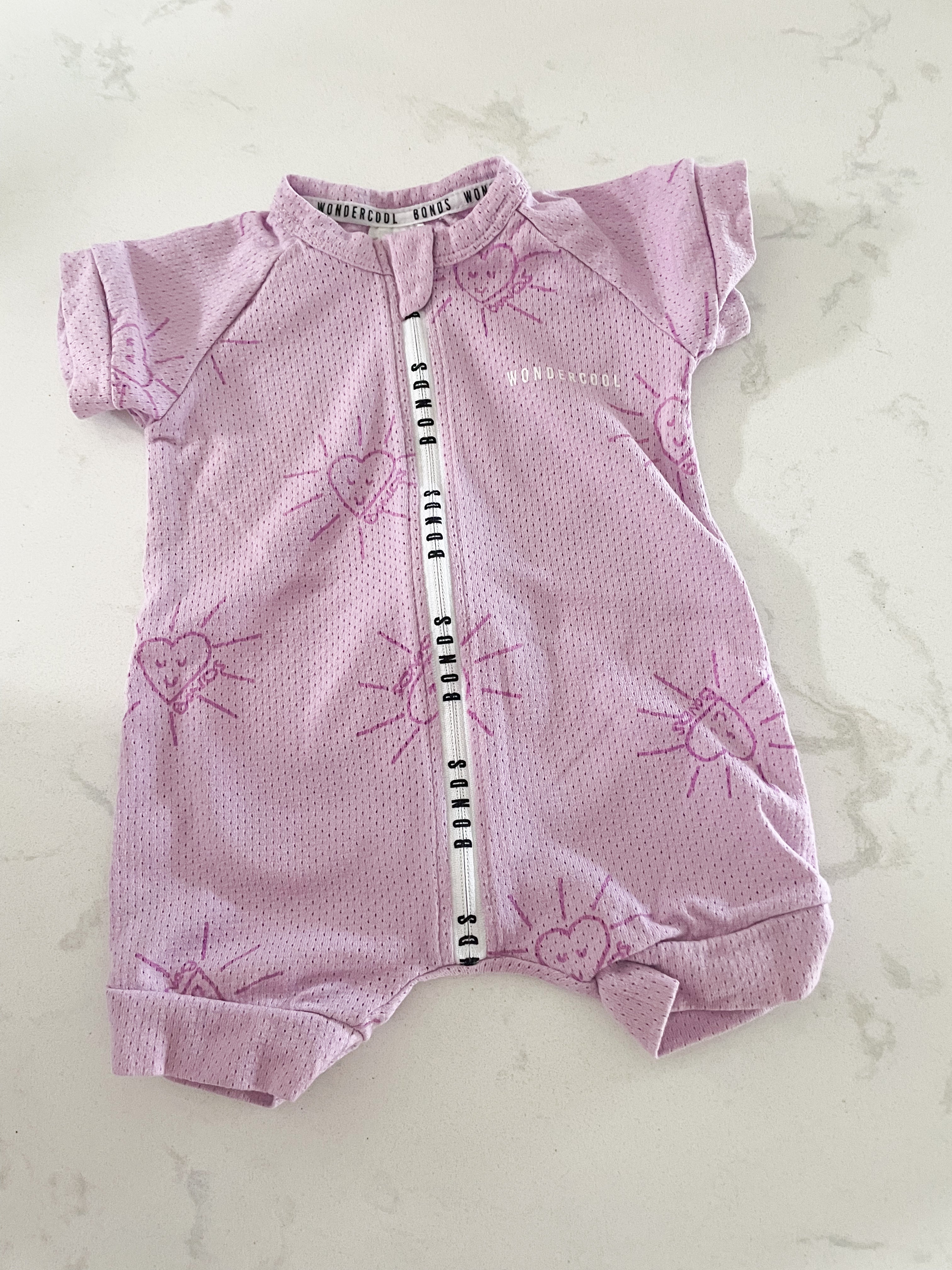 BONDS- size 000 (0-3 months)- purple wondercool wondersuit with heart suns