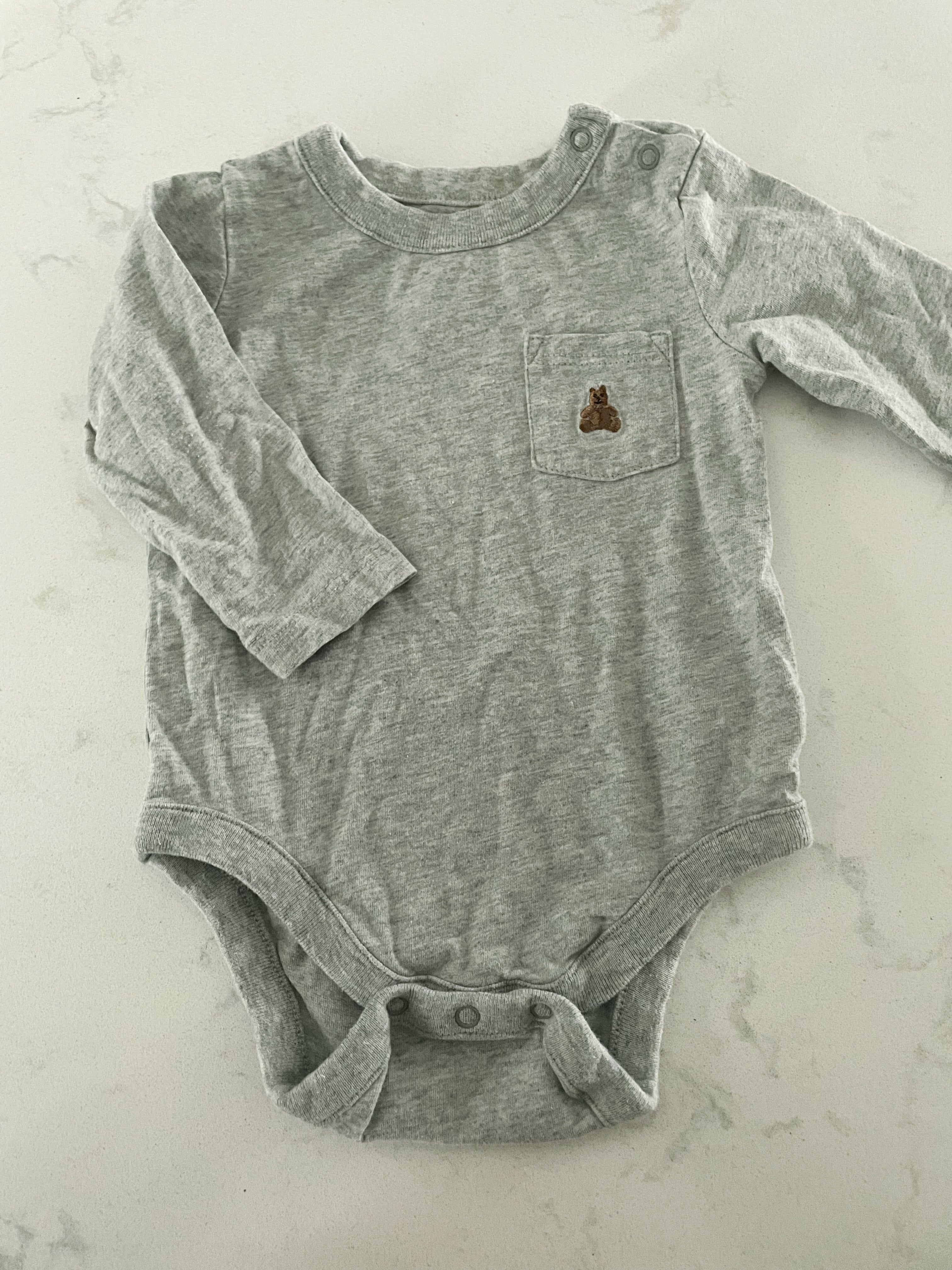 Baby Gap- 3-6 months- long sleeve grey bodysuit with pocket