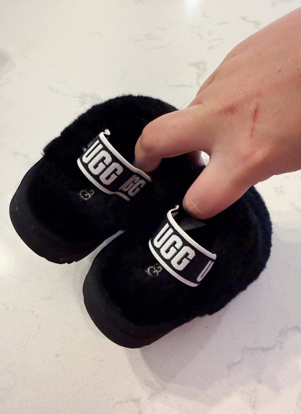 Uggs- 6C- BNWT- black fur slip on clogs with strap