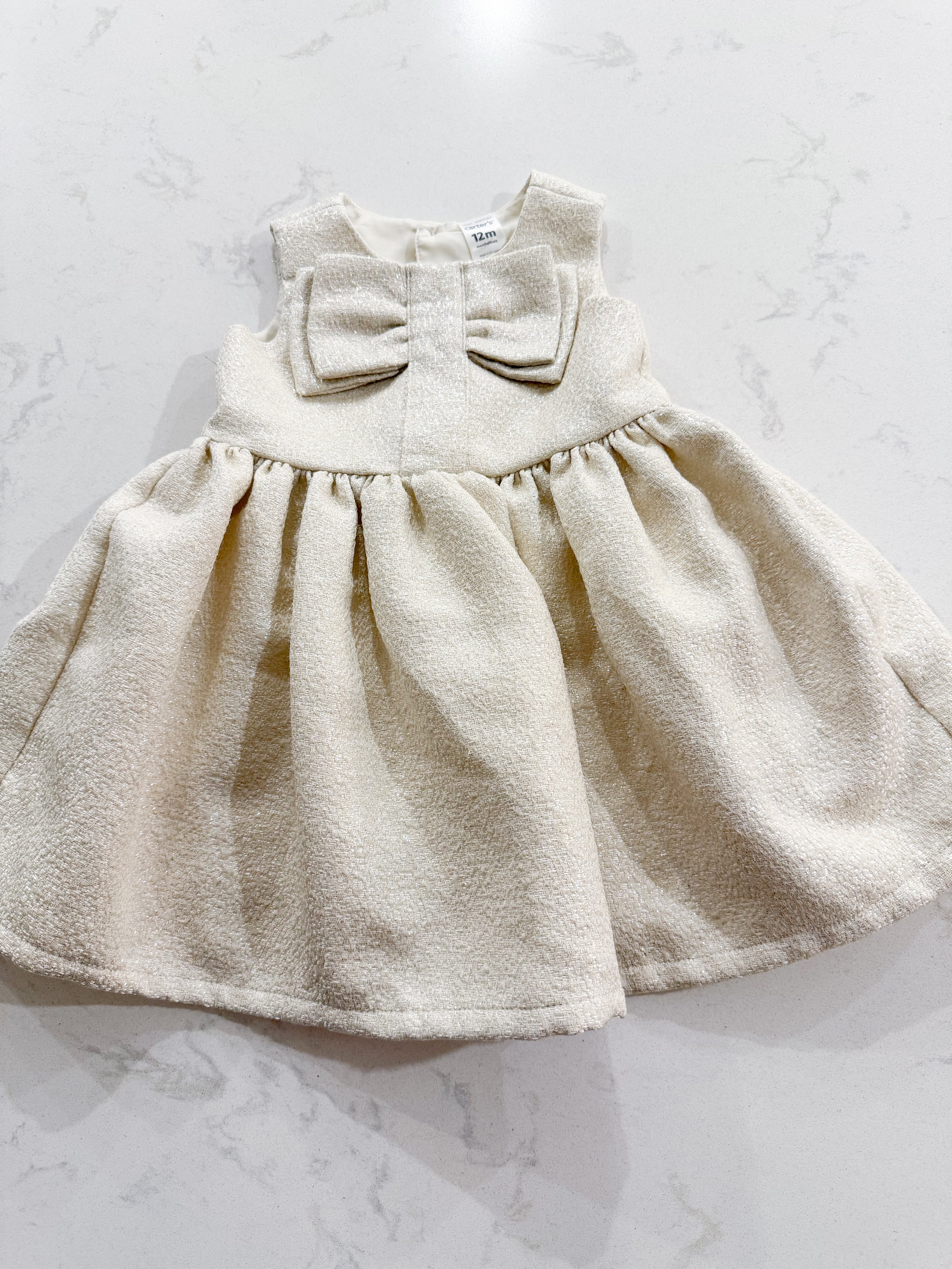 Carter’s- 12m- VGUC- white and gold sparkle dress with bow on chest