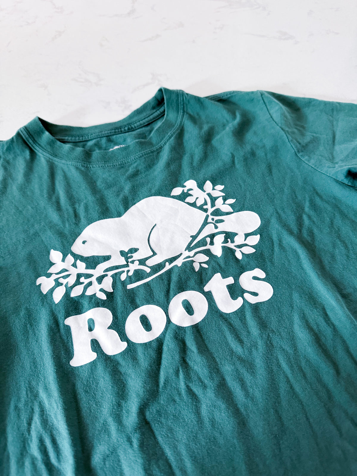 Roots- 11-12Y- GUC- Green t shirt with white logo
