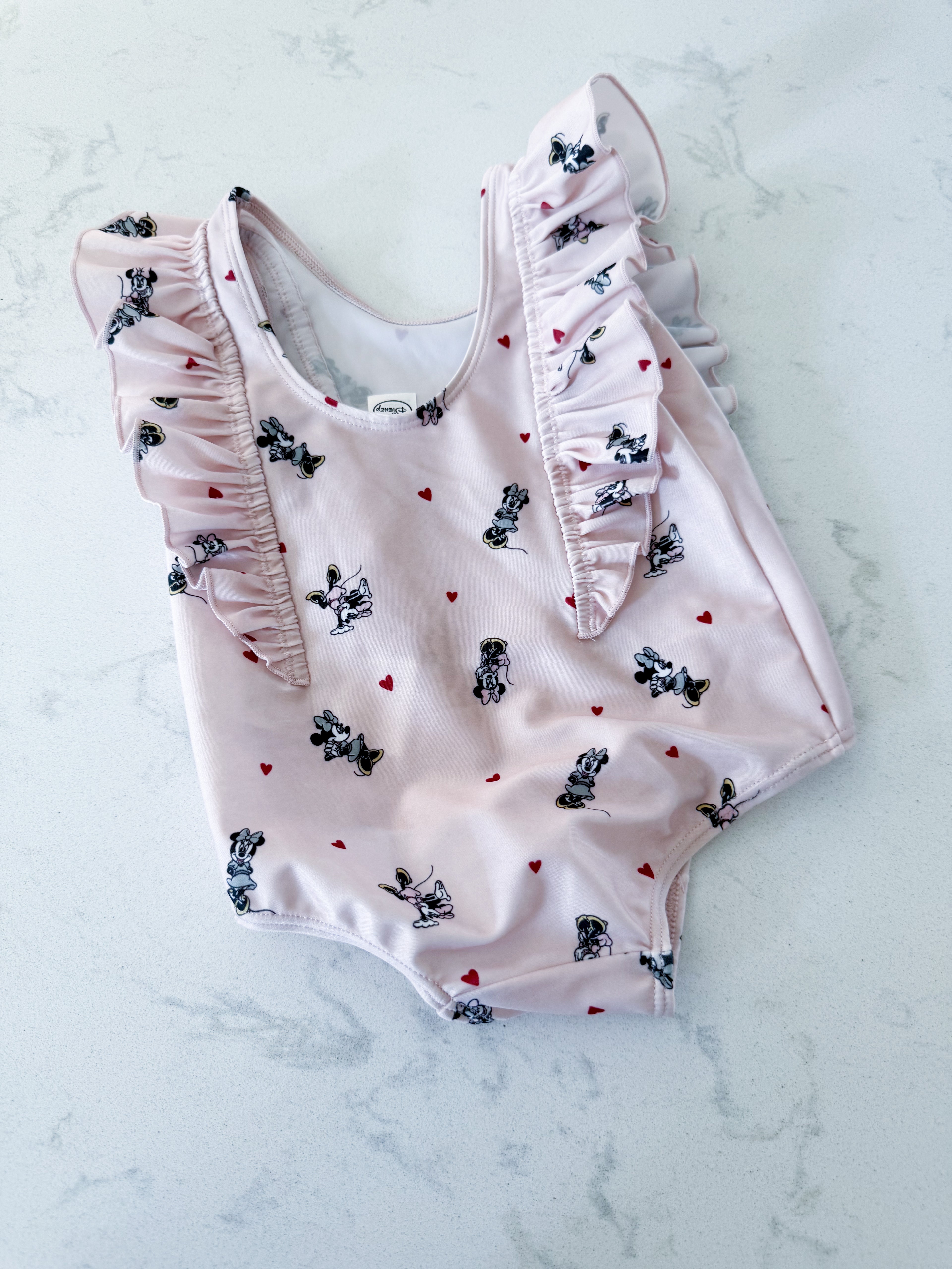 H&M- 9-12m- VGUC- light pink ruffle one piece swim suit with Minnie Mouse