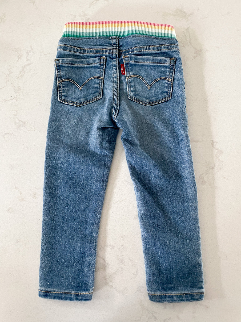 Levi’s- size tag removed (12-18m)- jeans with rainbow sweat band