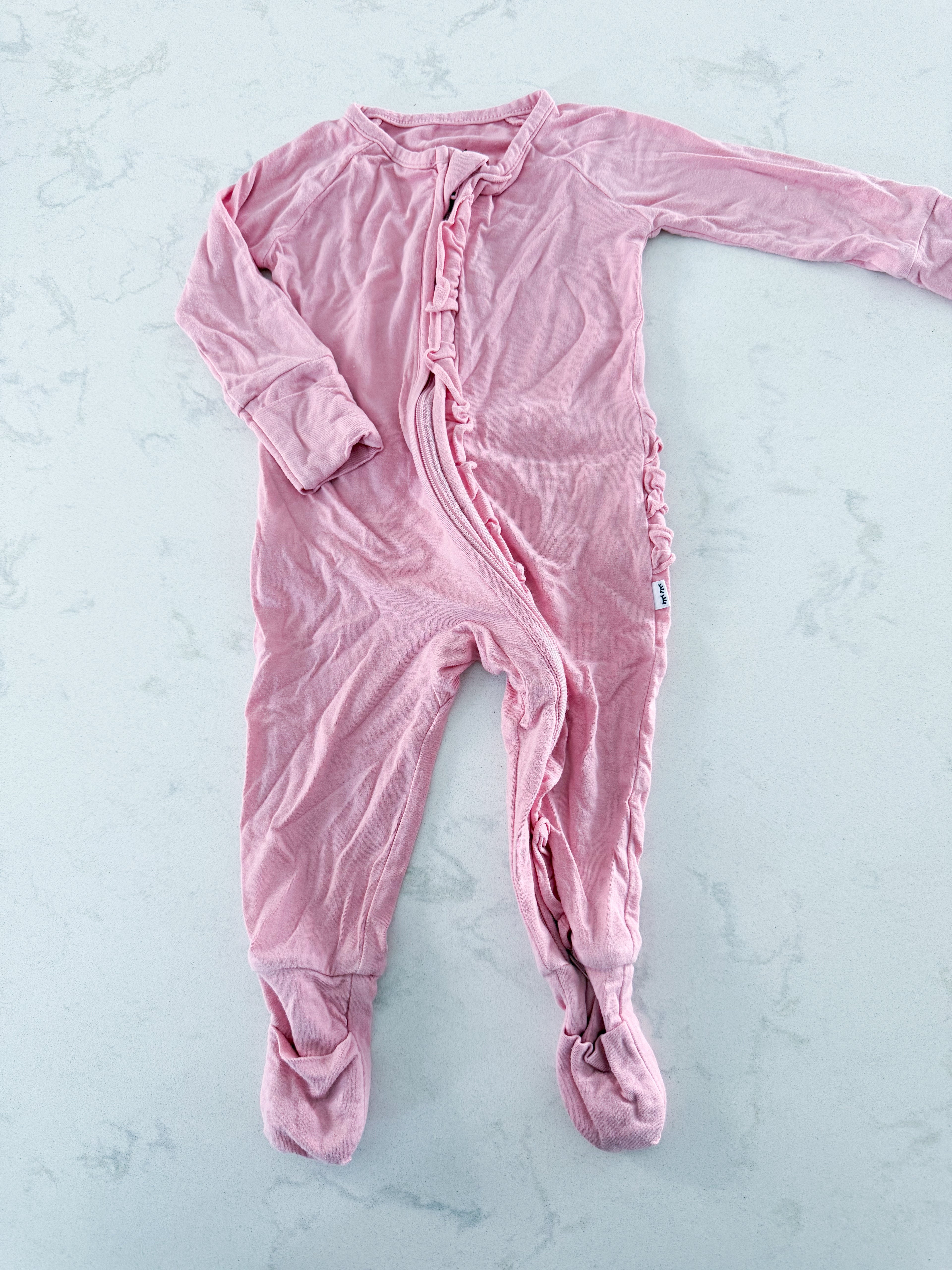 Little Sleepies- 0-3m- GUC- pink zip up bamboo footie with ruffle bum