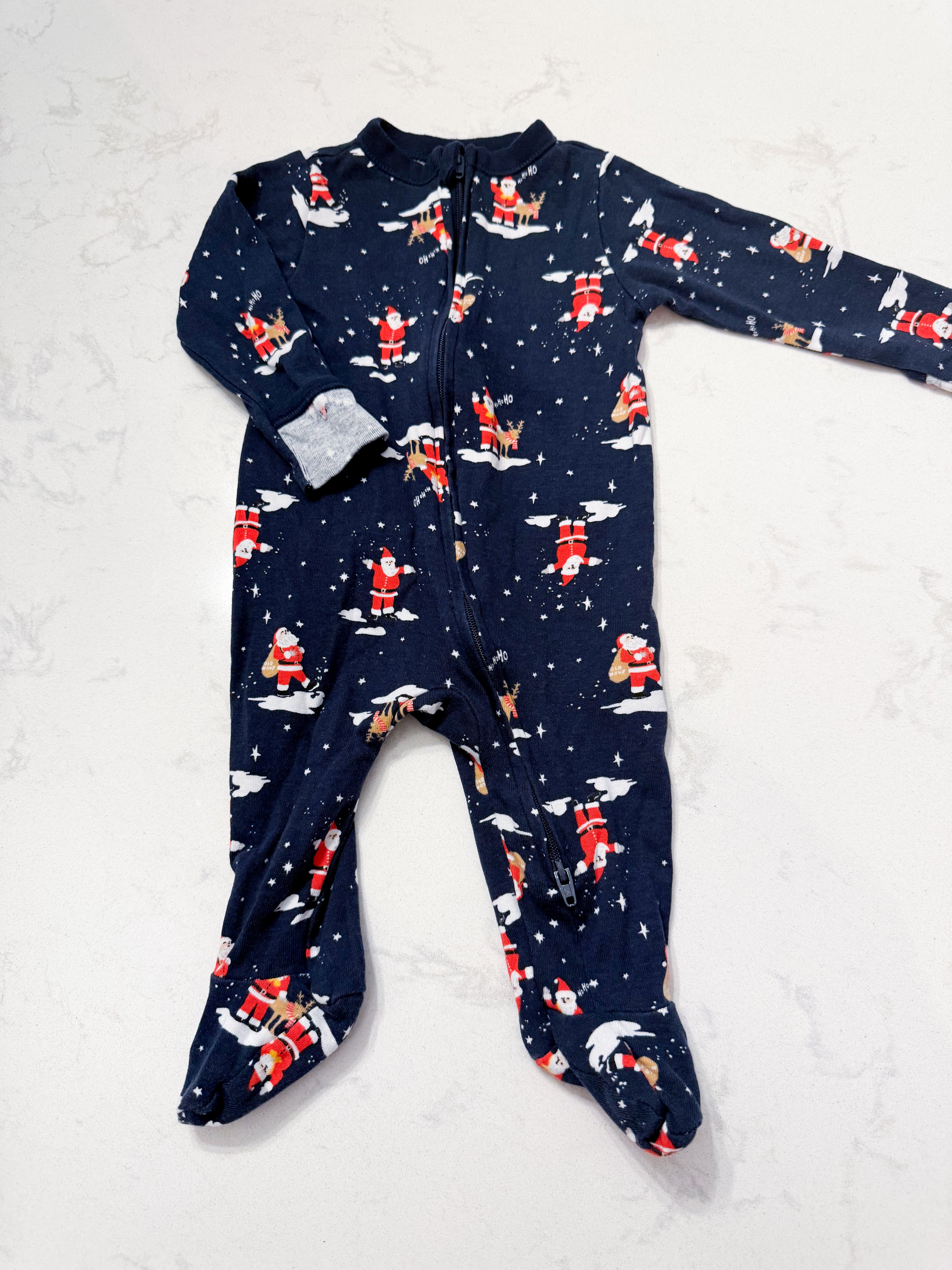 Old Navy- 3-6m- VGUC- navy footie pajamas with Santa pattern
