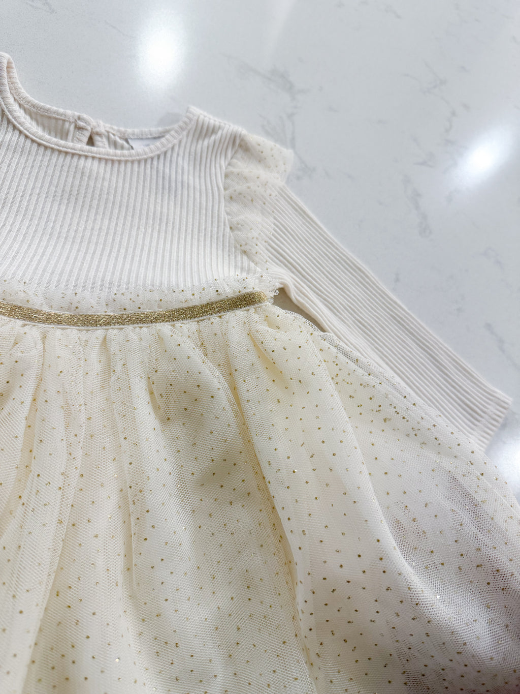 The Children’s Place- 9-12m- VGUC- long sleeve ribbed dress with gold sparkly tulle skirt