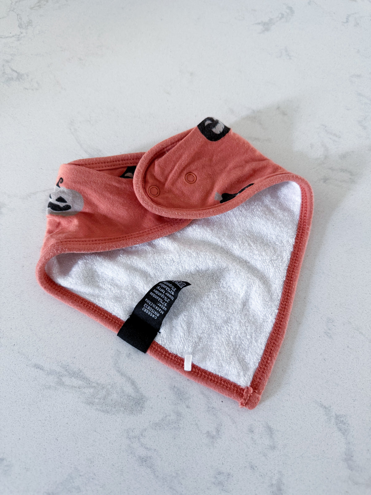 Kyte Baby- one size- GUC- orange bamboo drool bib with jack-o-lanterns and towel lining