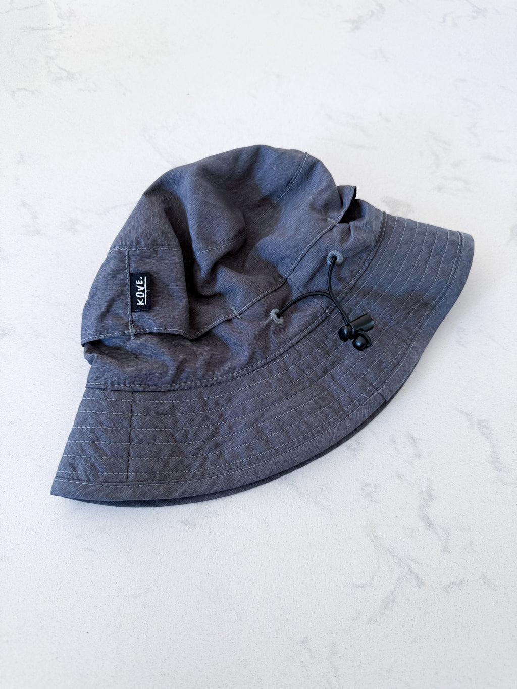 Hooké- 0-6m- VGUC- dark grey hat with strap