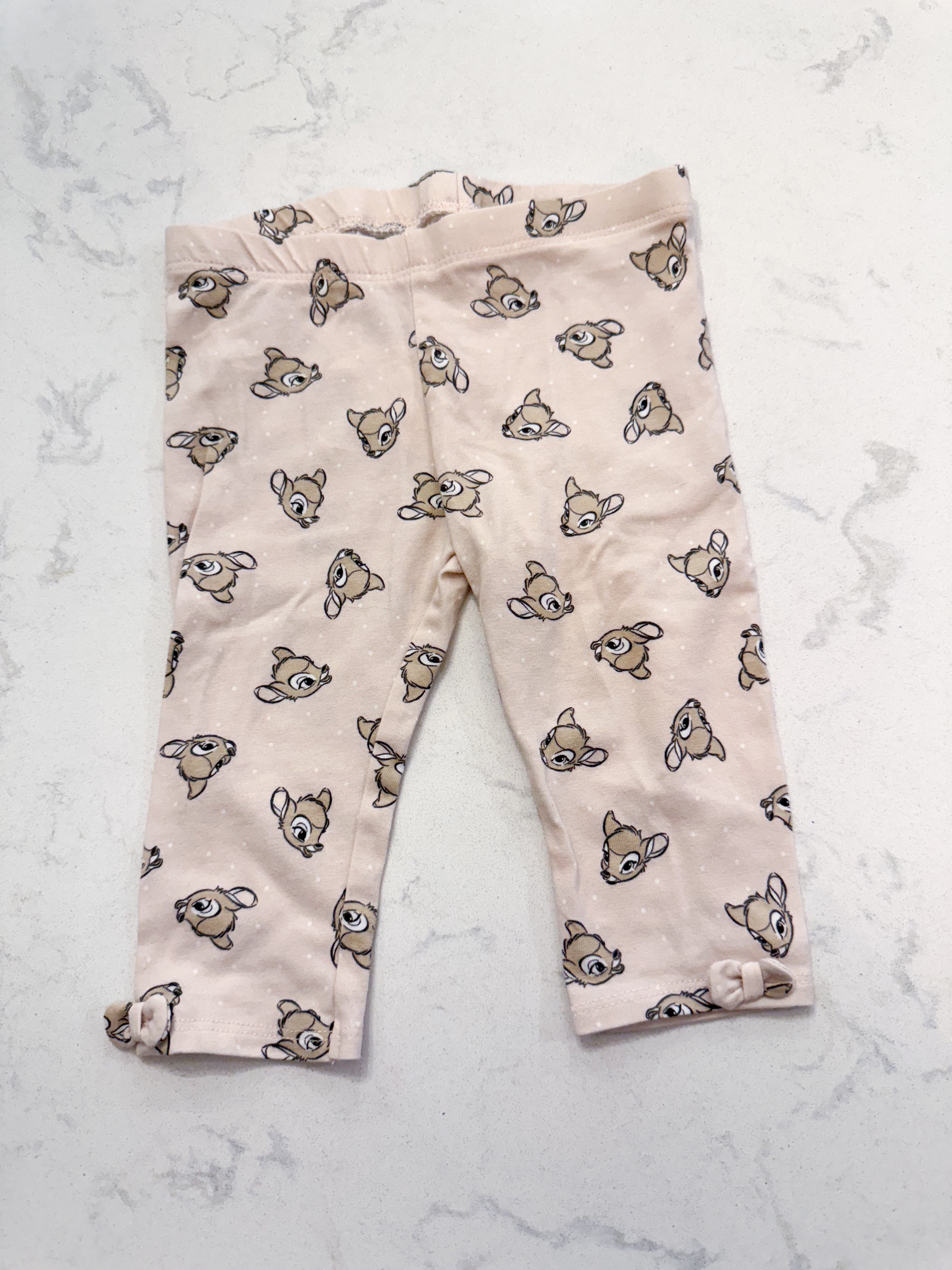 H&M- 9m- VGUC- light pink leggings with Bambi heads