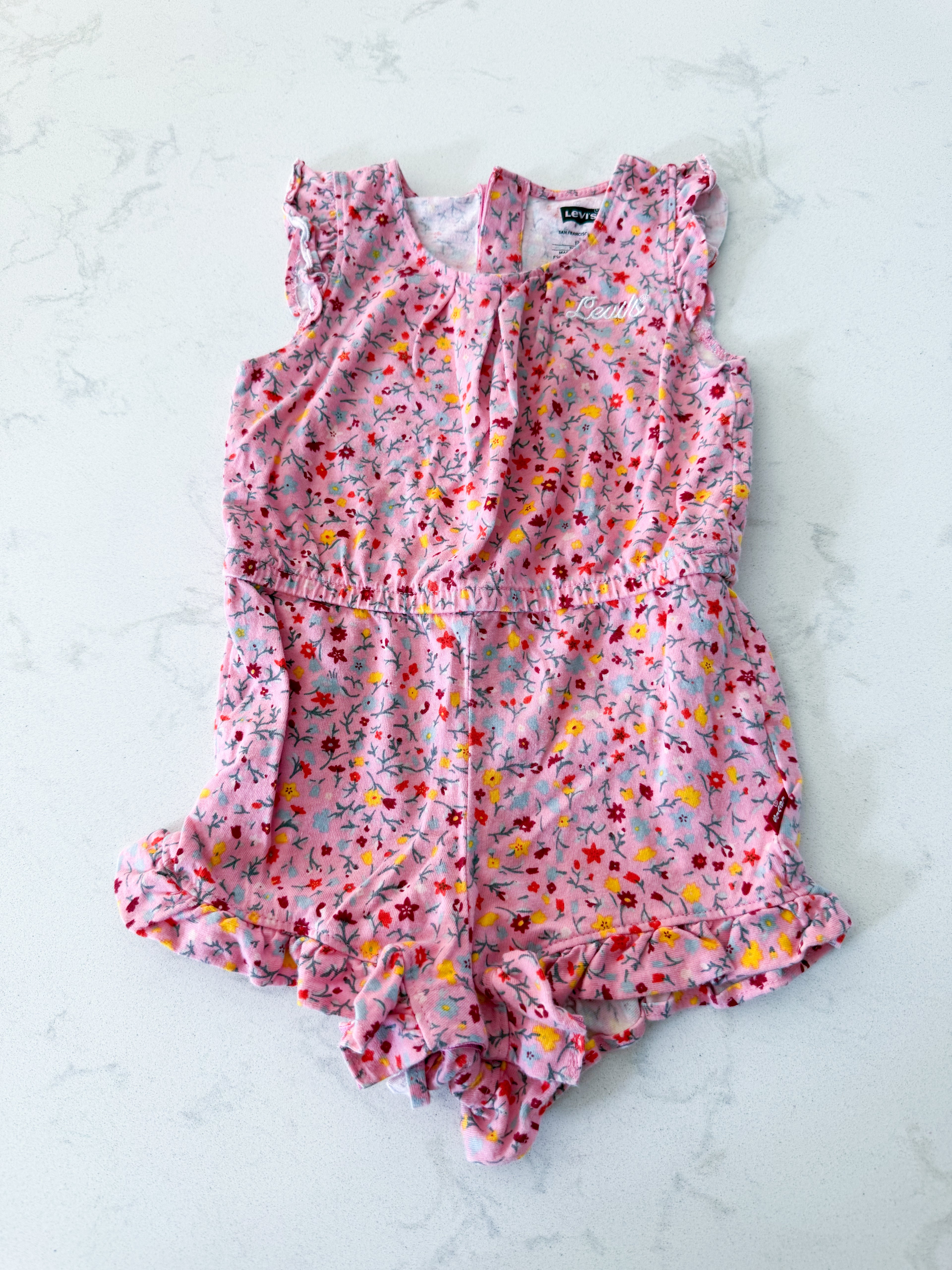 Levi’s- 6-12m- VGUC- pink romper with tiny bright florals and embroidered symbol