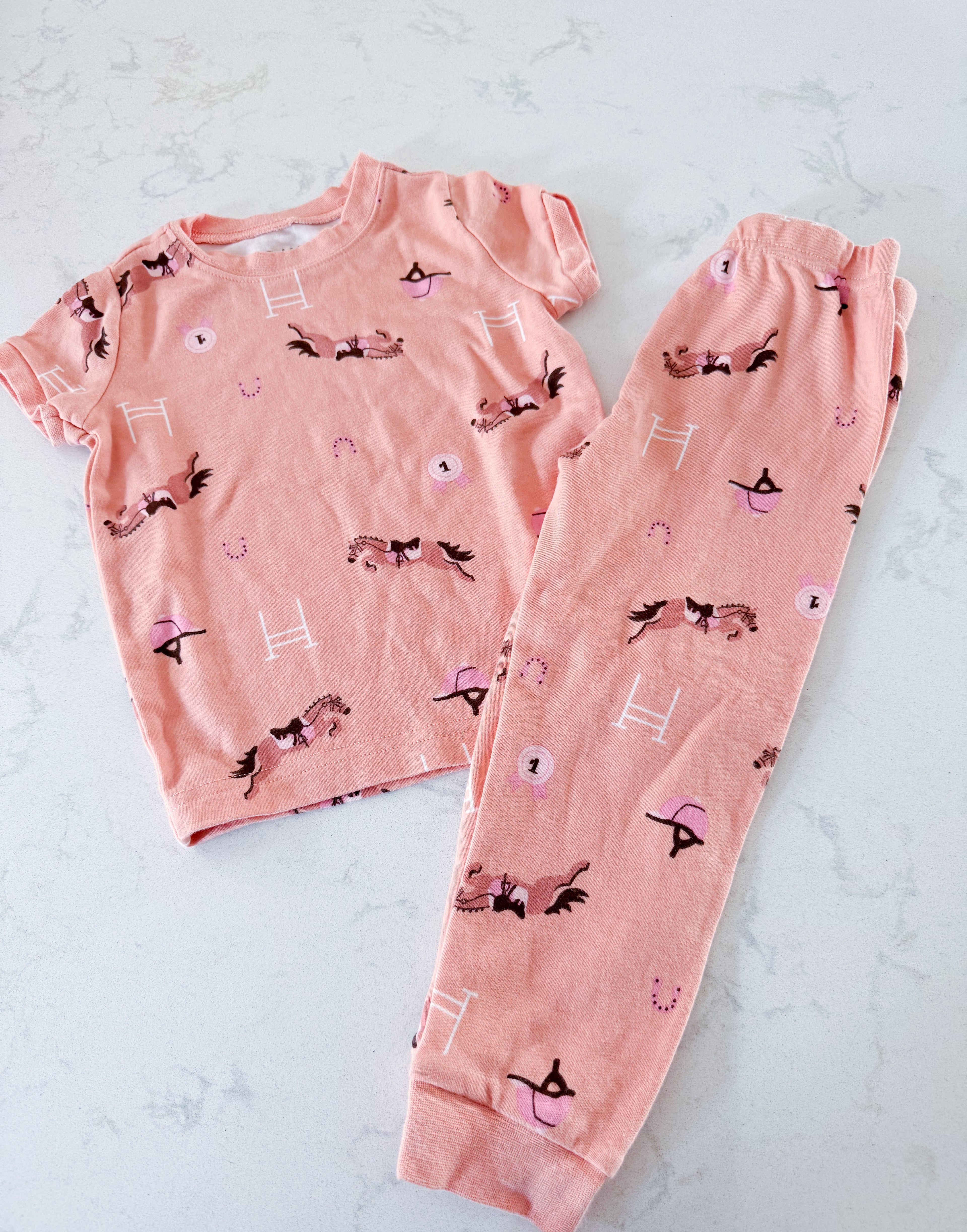 Pekkle- 2/3Y- VGUC- pastel orange jammies with horse back riding print short sleeves and pants