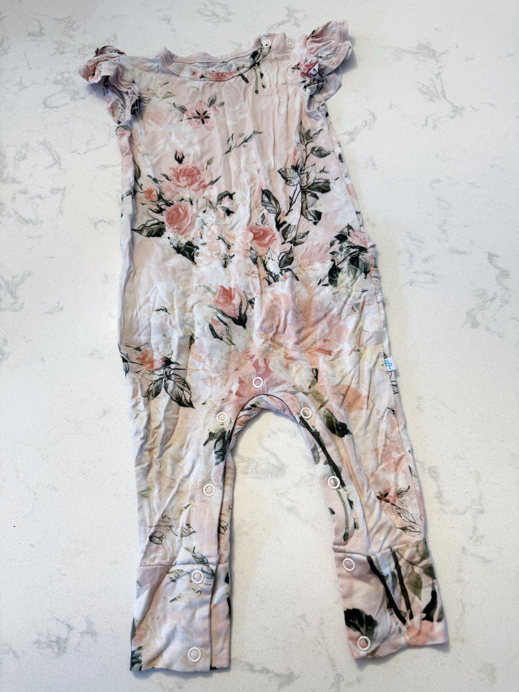 Posh Peanut- 9-12m- GUC- light pink short sleeve bamboo romper with rose pattern and ruffle bum