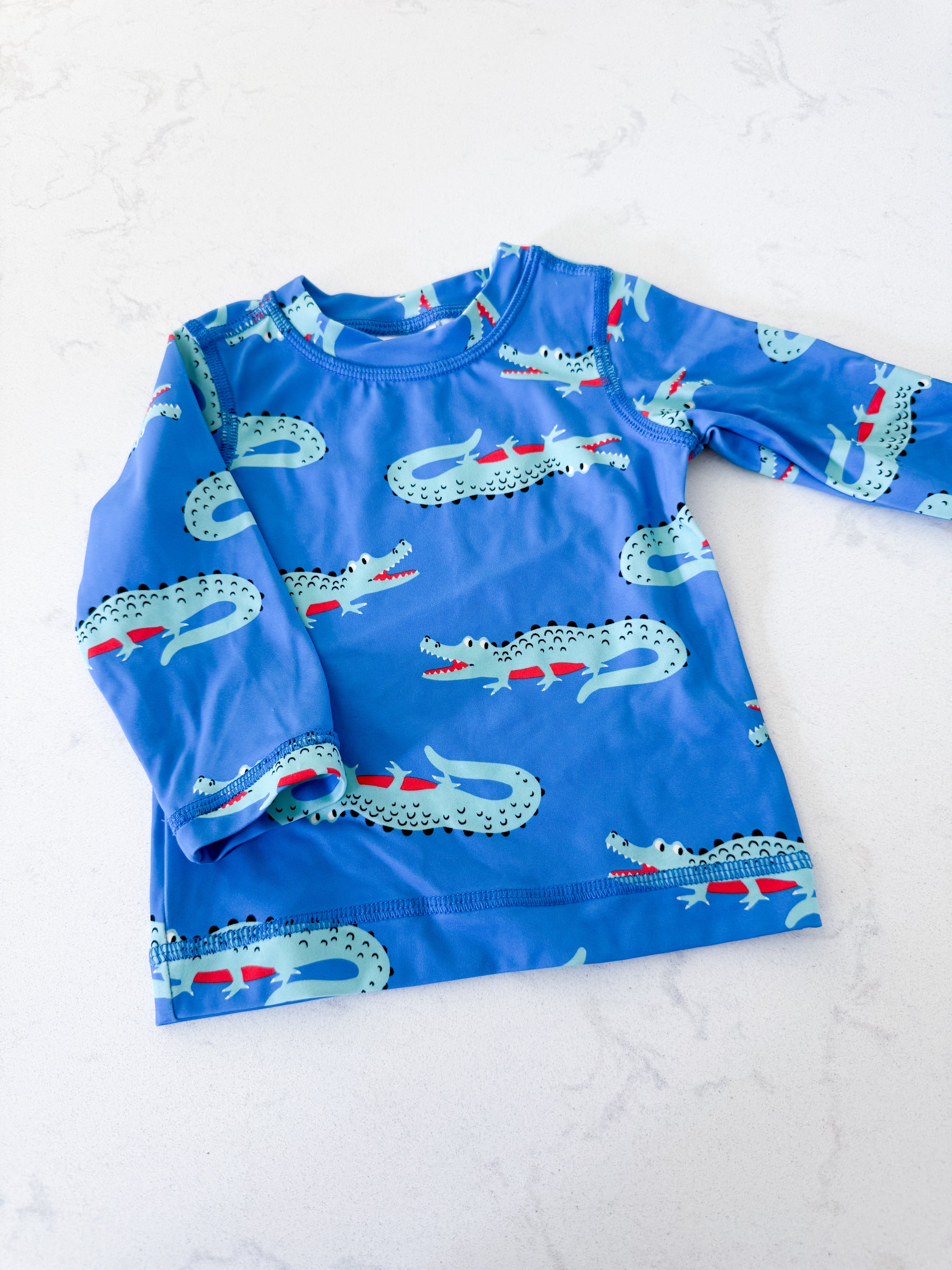 Hanna Andersson- 3-6m- VGUC- blue crocodile rash guard