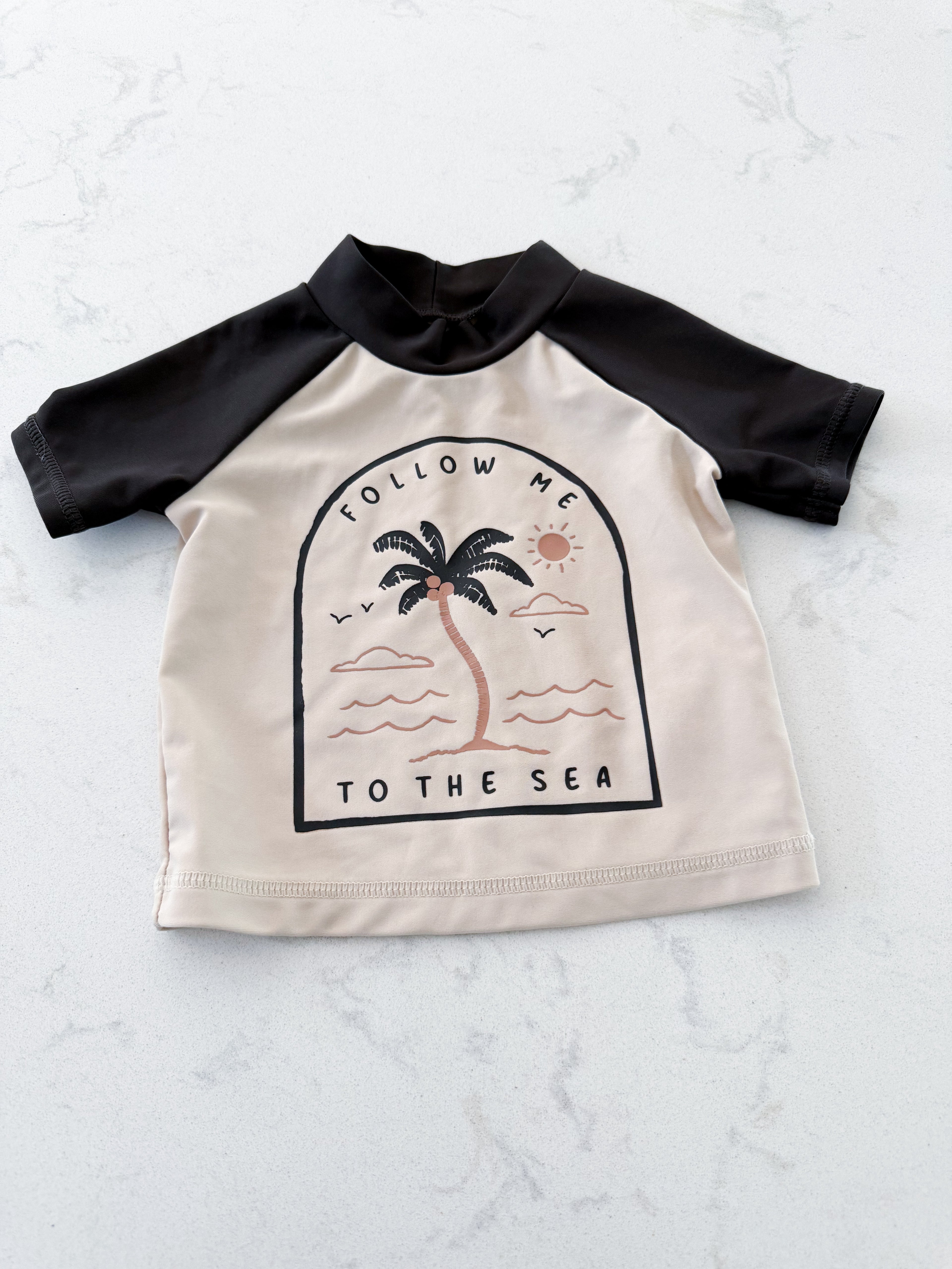 Carters- 3m- VGUC- beige rashguard with black palm tree graphic