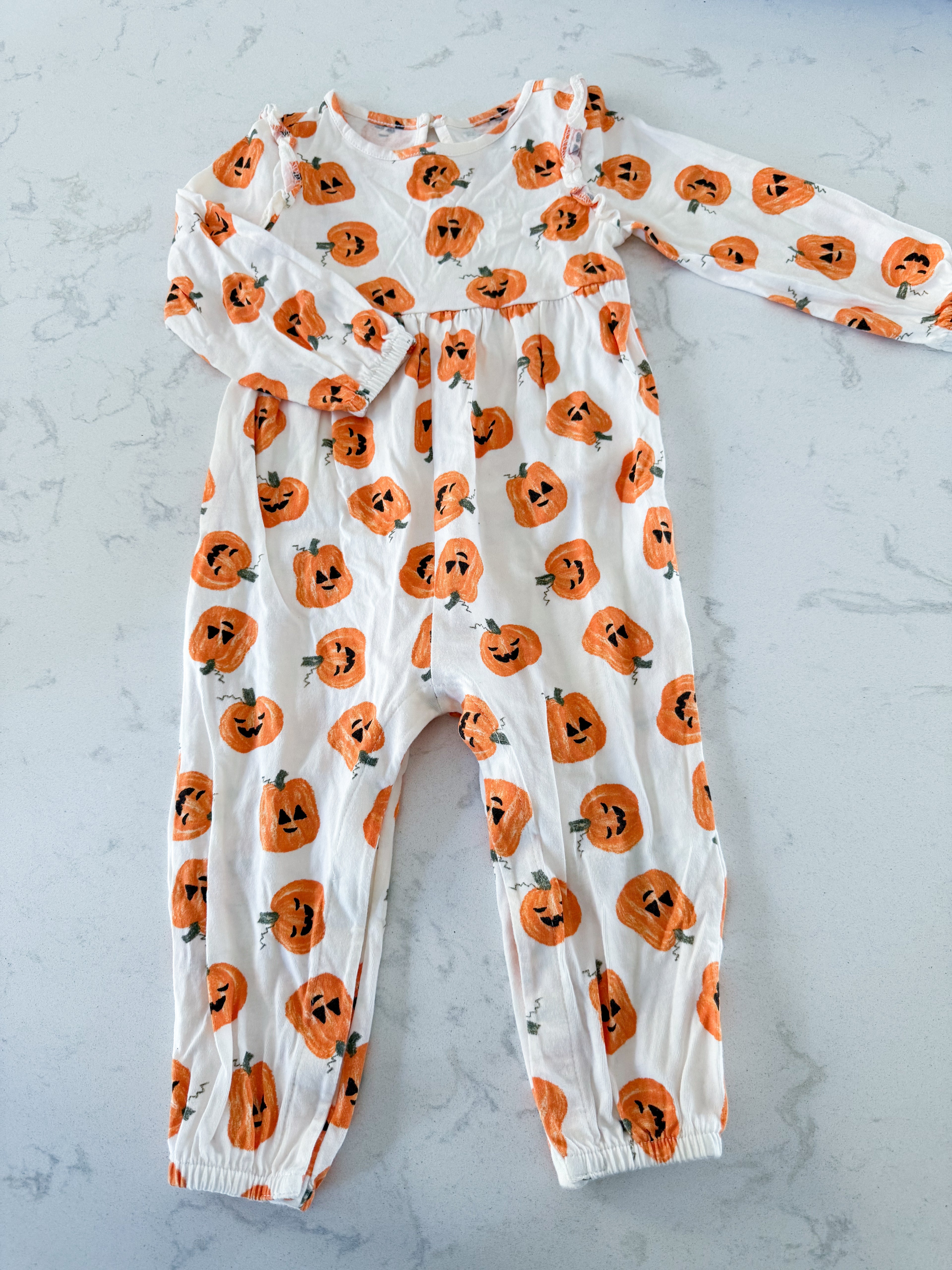 Old Navy- 18-24m- VGUC- cream coloured ruffle romper with pumpkins