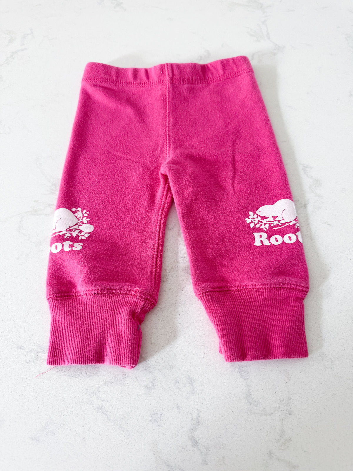 Roots- 3-6m- PLAY- bright pink leggings with cuffs and white Roots logos