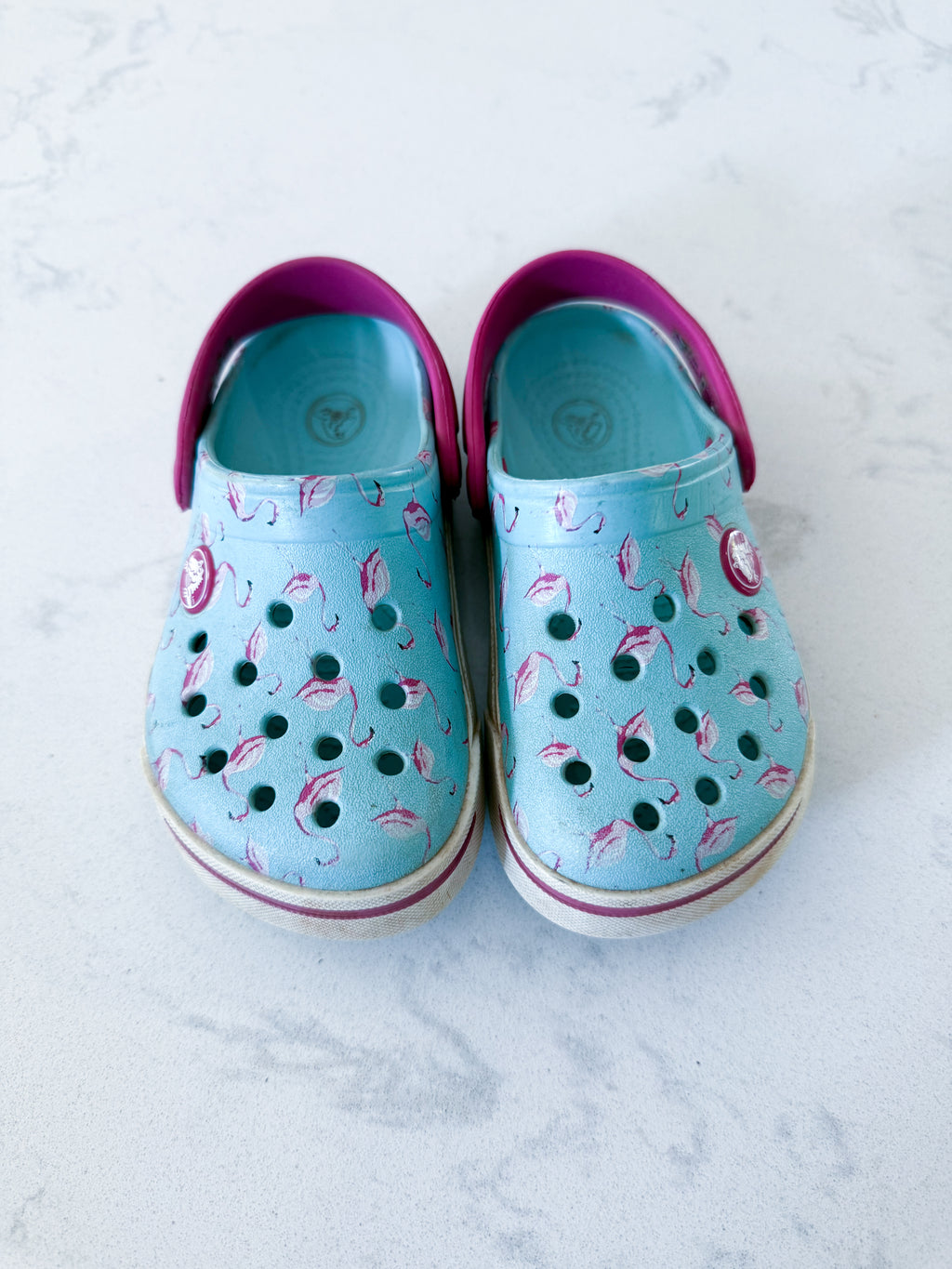 Crocs- 8/9C- PLAY- light blue slip ons with pink flamingos