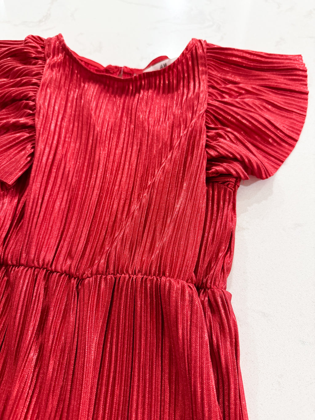 H&M- 3T- EUC- think metallic ribbed romper with ruffled sleeves