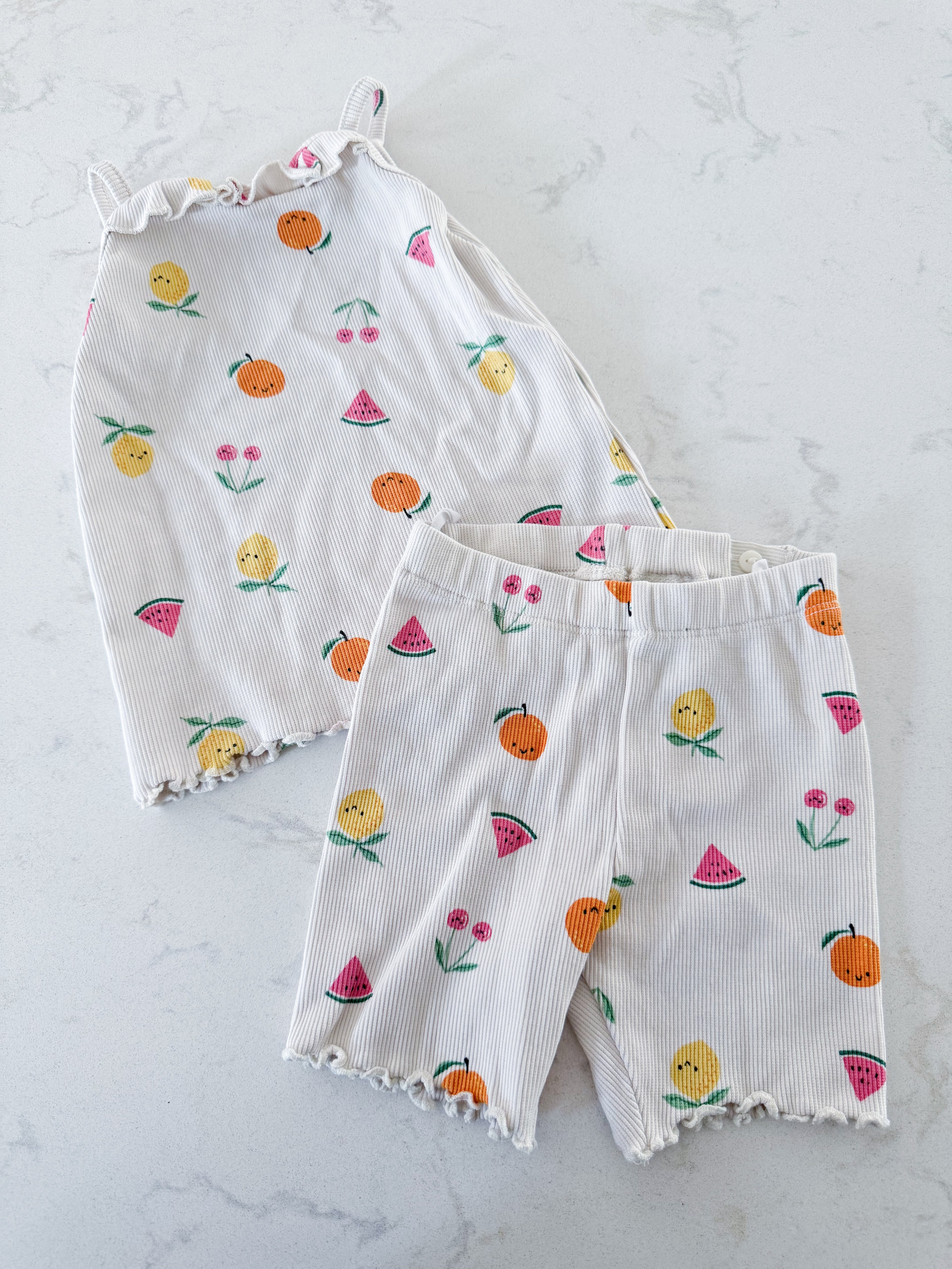 H&M- 12-18m- GUC- cream coloured ribbed tank and shorts set with fruit graphics