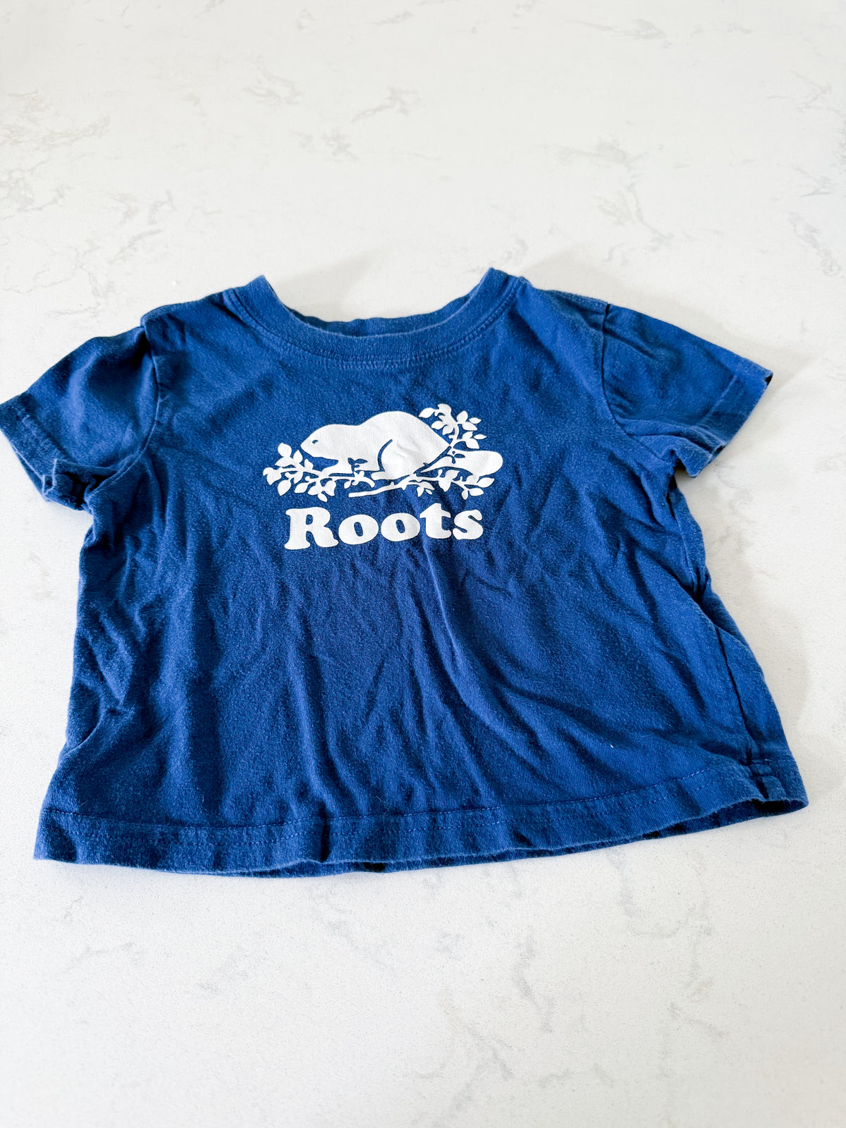 Roots- 12-18m- PLAY- blue t shirt with white Roots logo