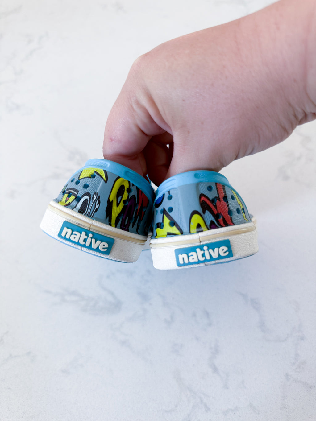 Natives- 7C- GUC- slip ons with comic graphics