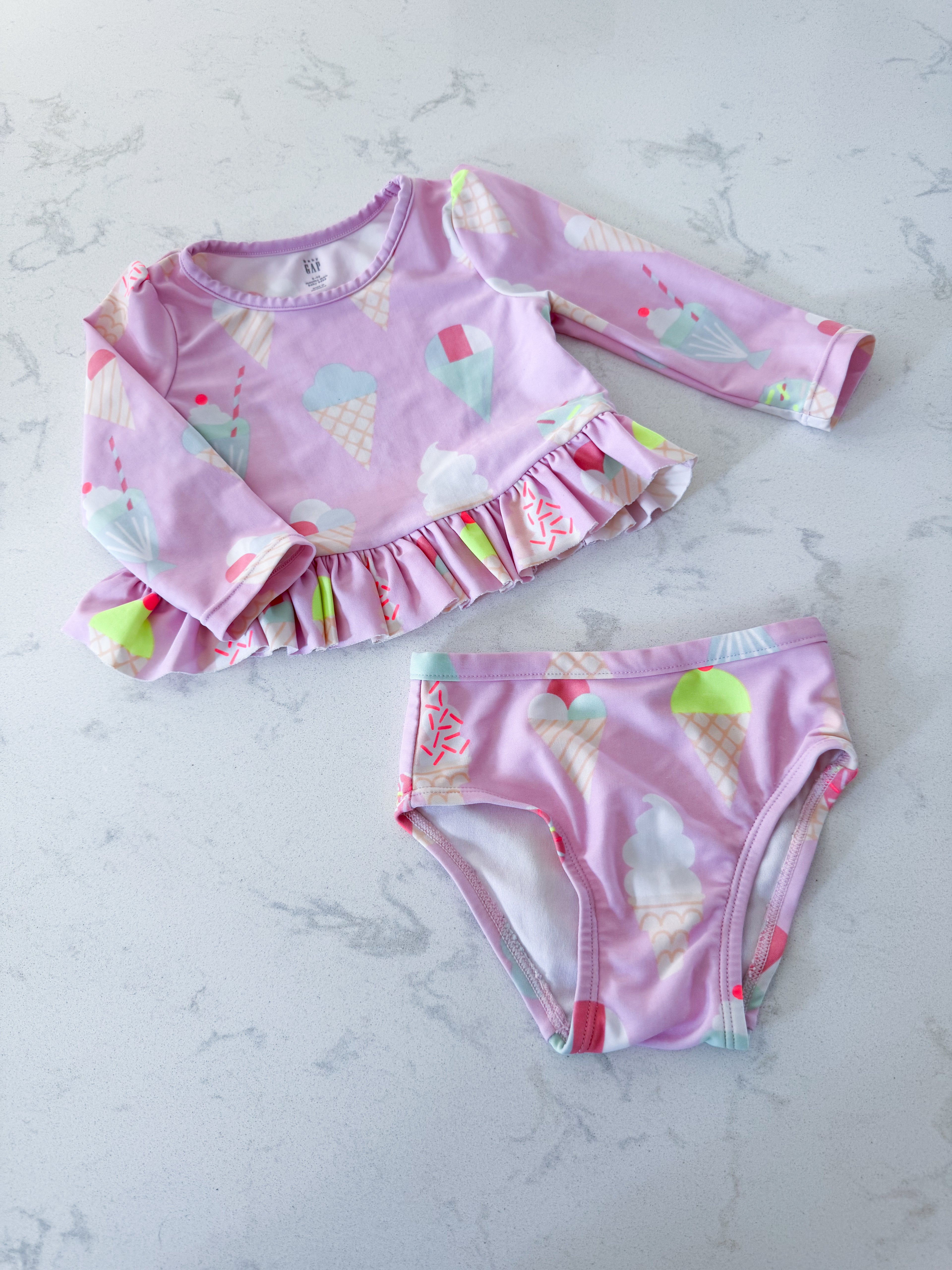 Baby Gap- 6-12m- VGUC- pink two piece swimsuit with ice cream graphic