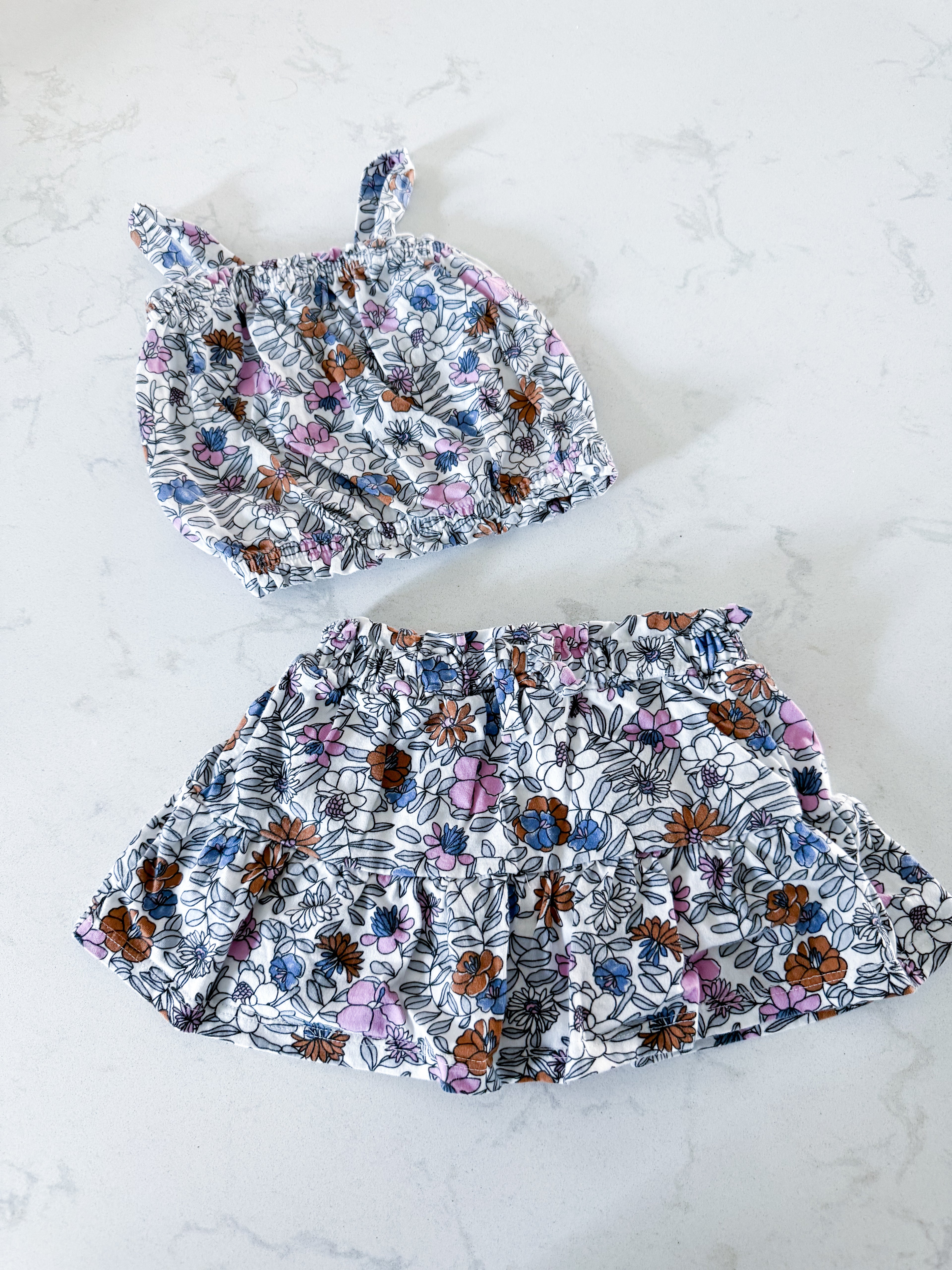 Carters- 12m- VGUC- White with purple, blue and brown florals