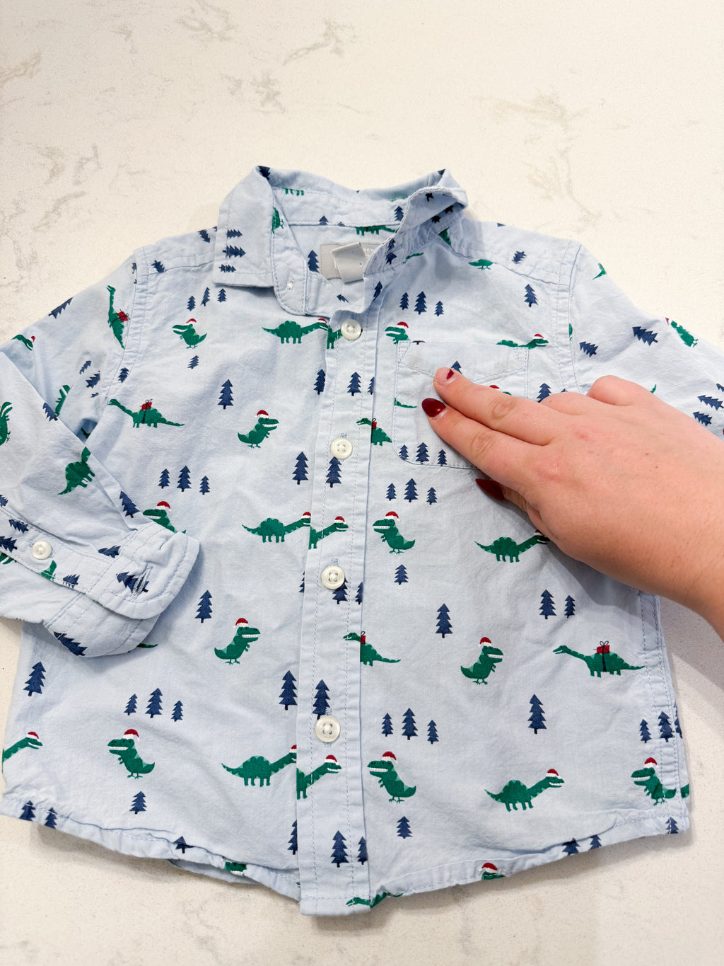 The Children’s Place- 12-18m- PLAY- light blue dress shirt with Christmas Dino’s all over