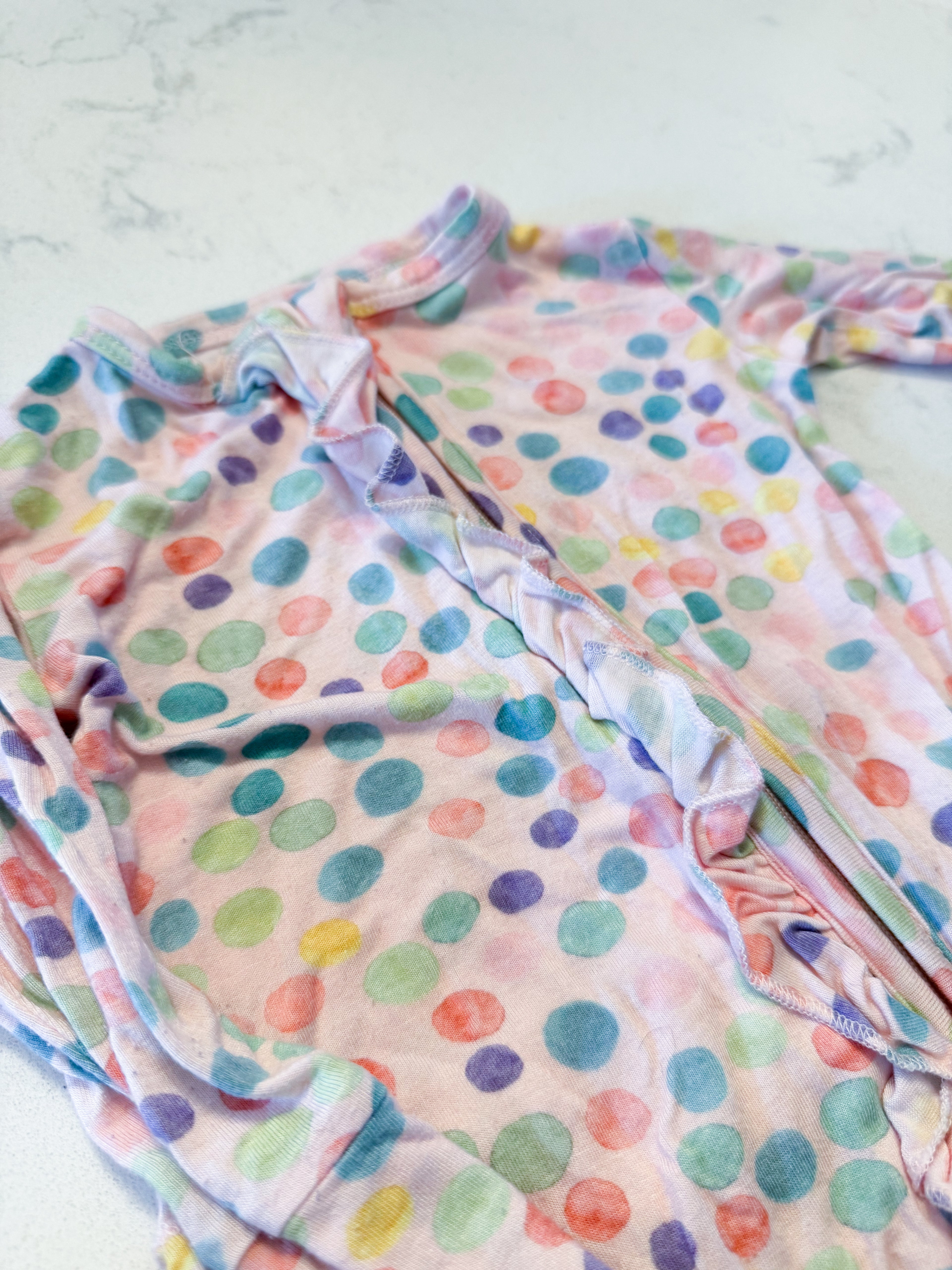 Posh Peanut- 3-6m- GUC- light pink bamboo footie pajamas with ruffle bum and zipper