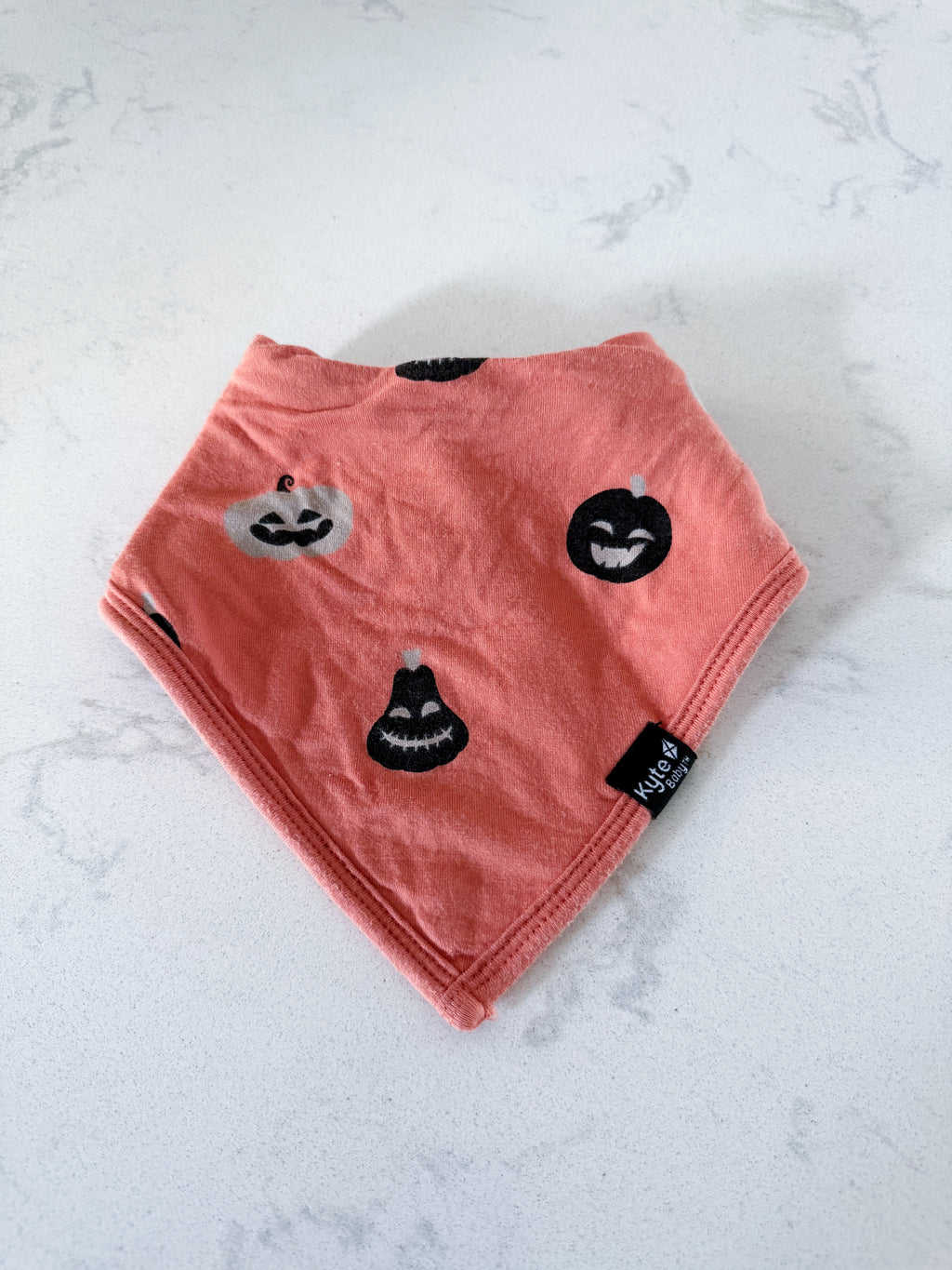 Kyte Baby- one size- GUC- orange bamboo drool bib with jack-o-lanterns and towel lining
