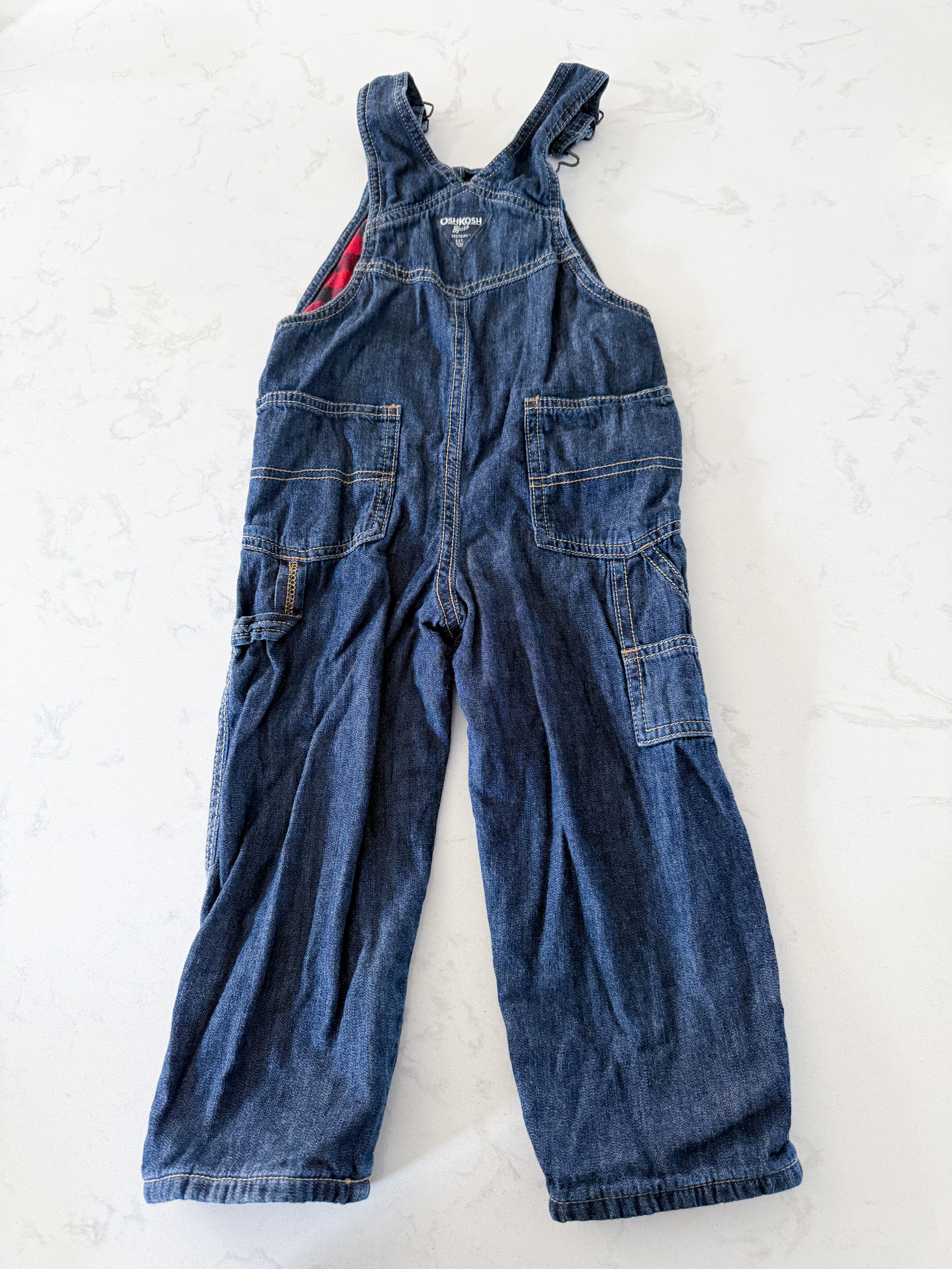 Oshkosh- 3T- GUC- jean overalls with red and black checkered lining