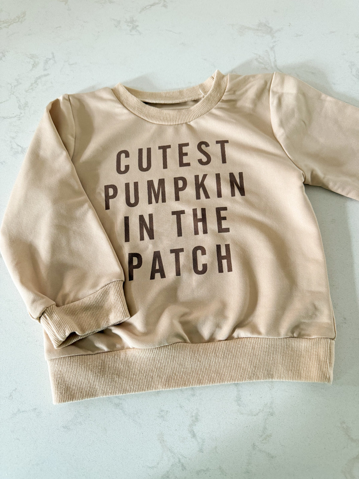 No brand- fits 12-24m- VGUC- cream coloured crewneck with “cutest pumpkin in the patch”