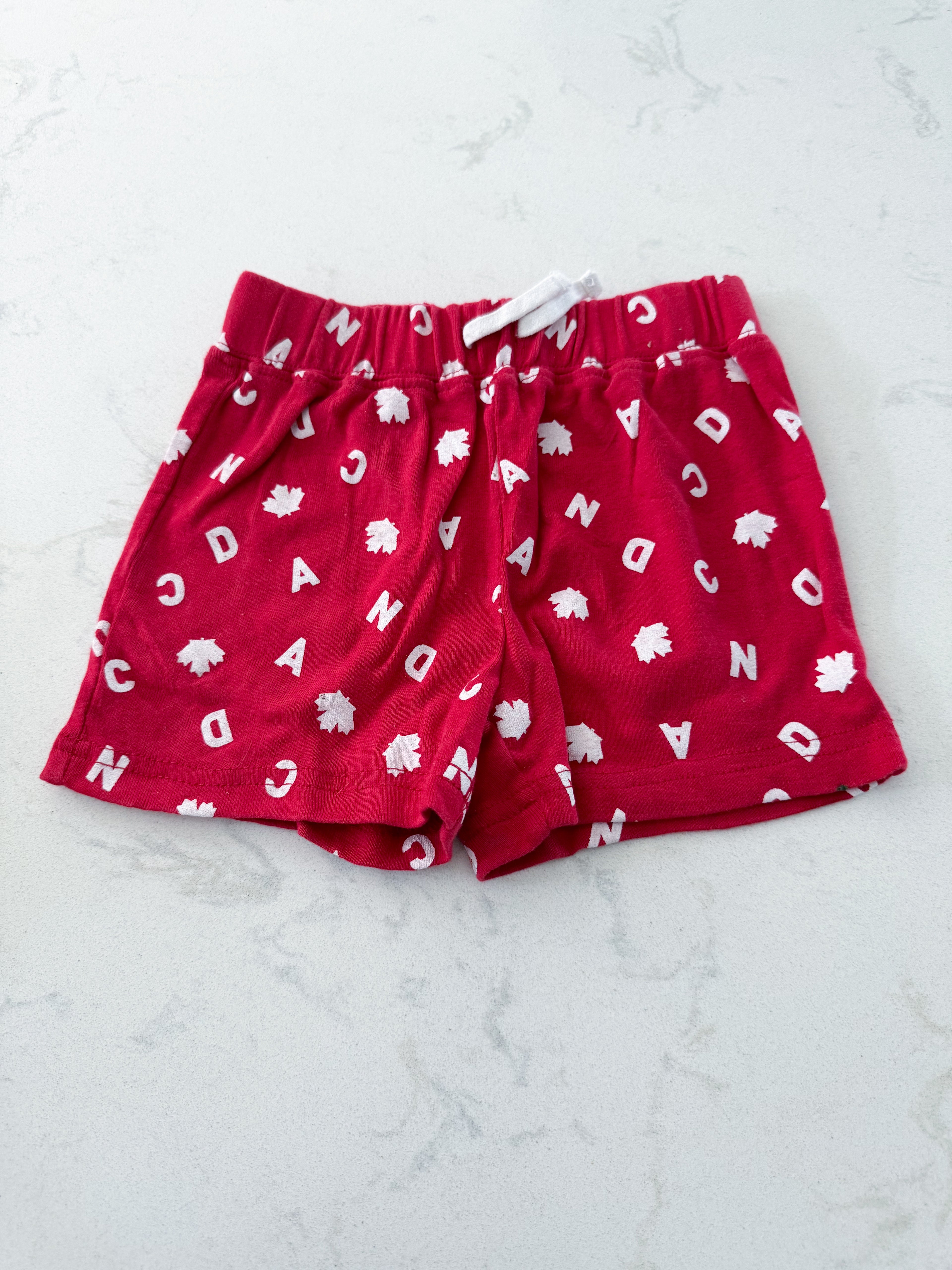 Joe fresh- 6-12m- GUC- red shorts cloth with Canada letters