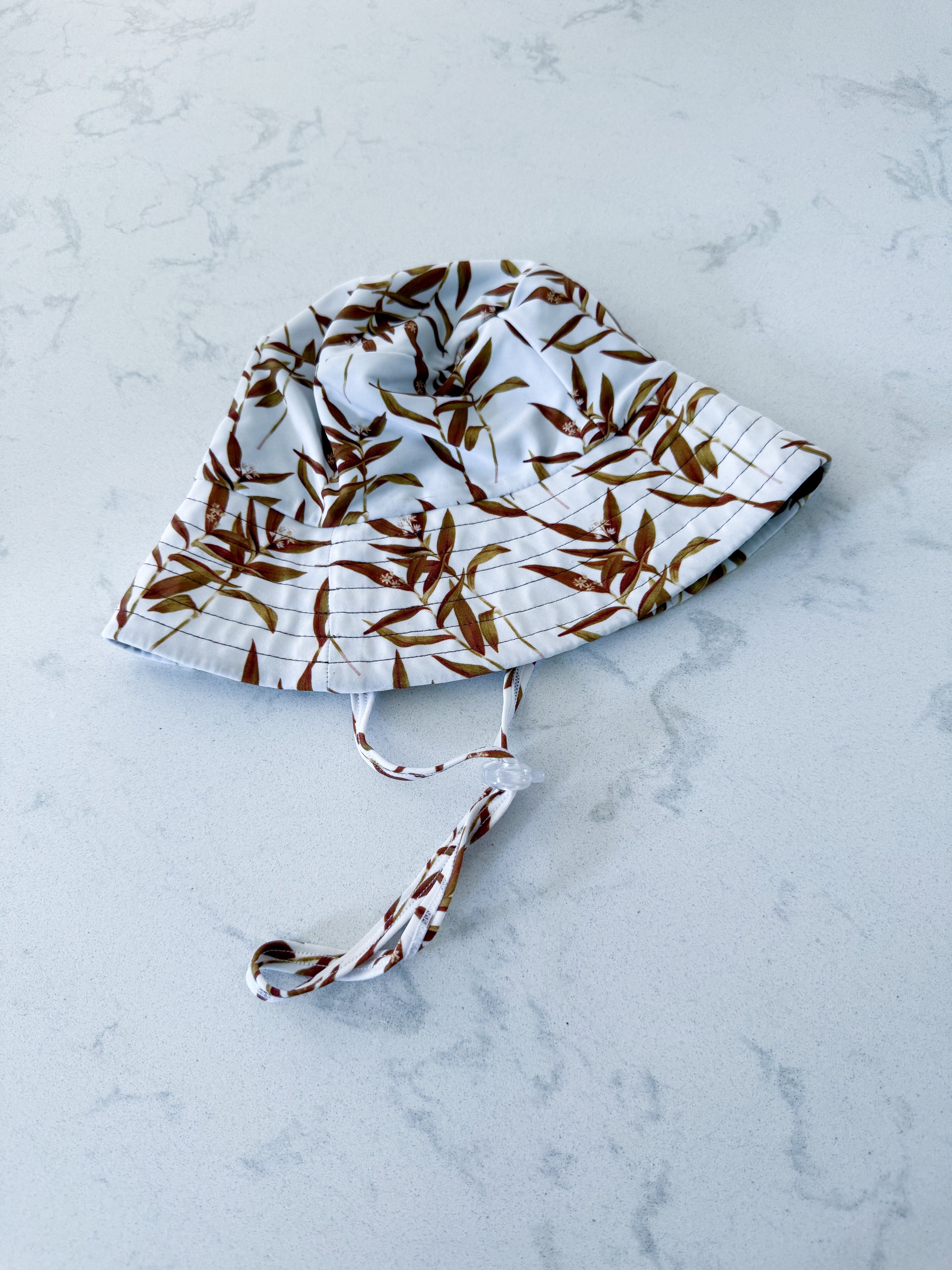 Little Bo- infant size- VGUC- white with brown leaves swim hat
