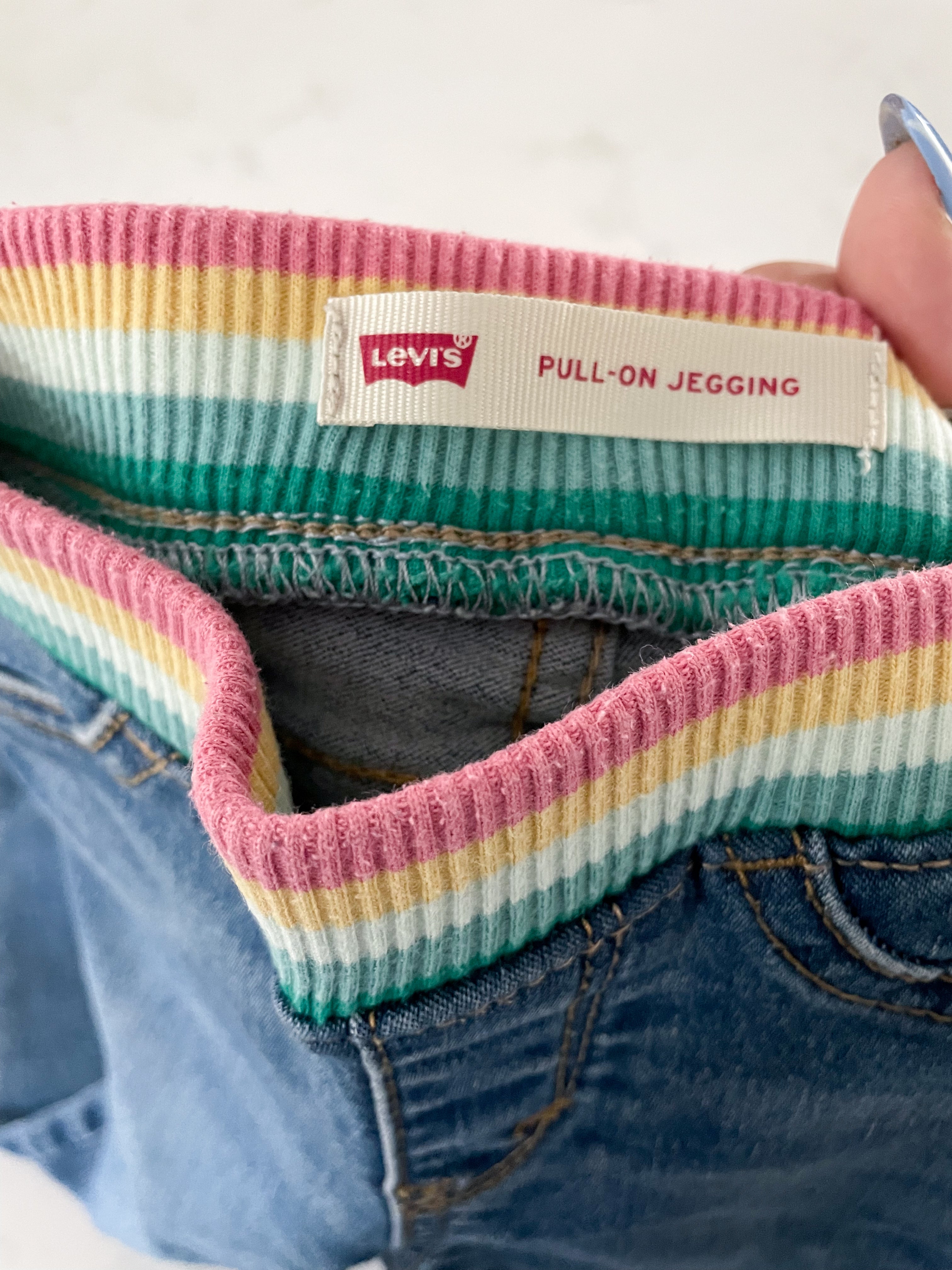 Levi’s- size tag removed (12-18m)- jeans with rainbow sweat band