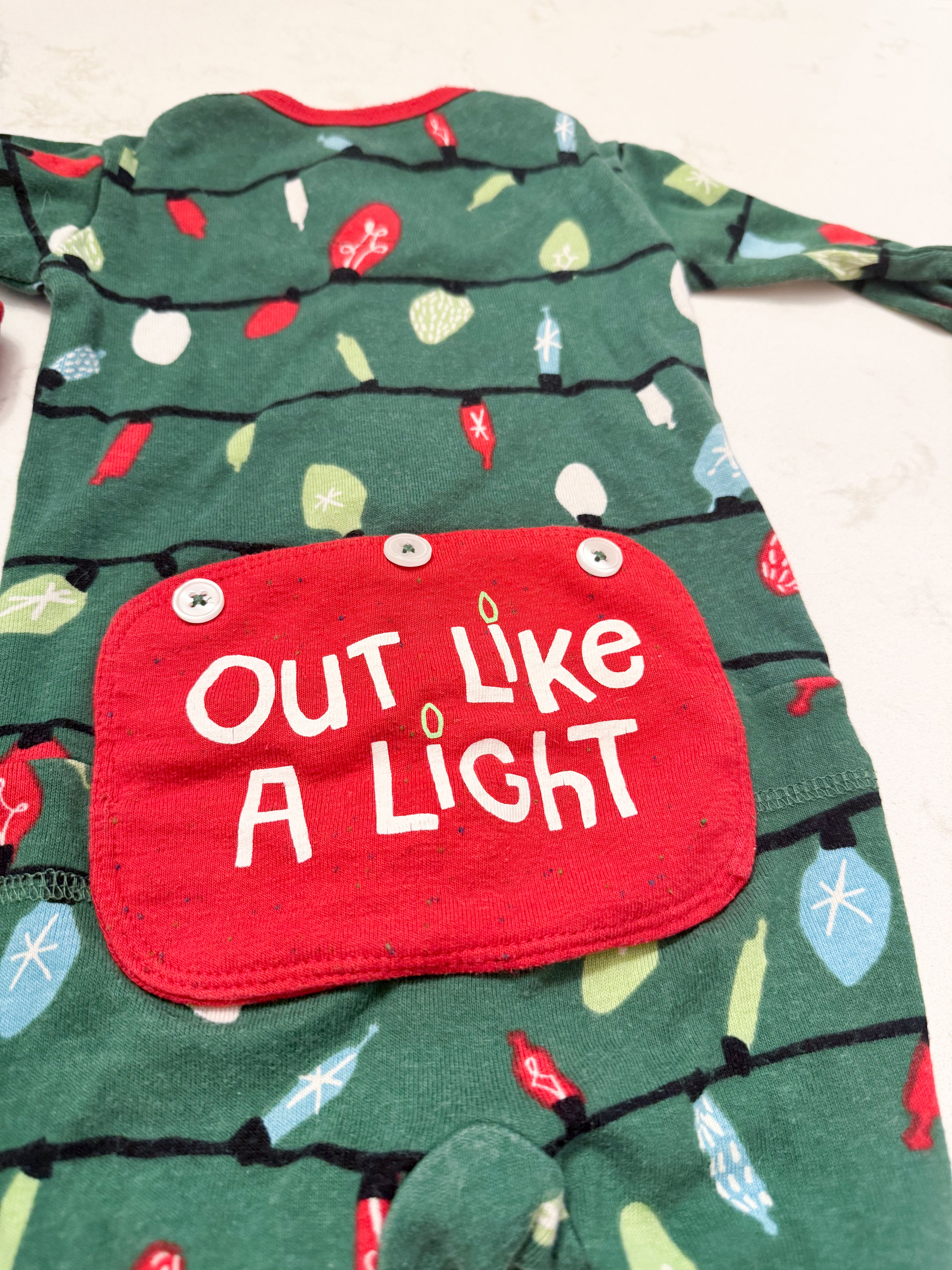 Little Blue House- 12-18m- GUC- green footless pajamas with patch on bum and Christmas light pattern