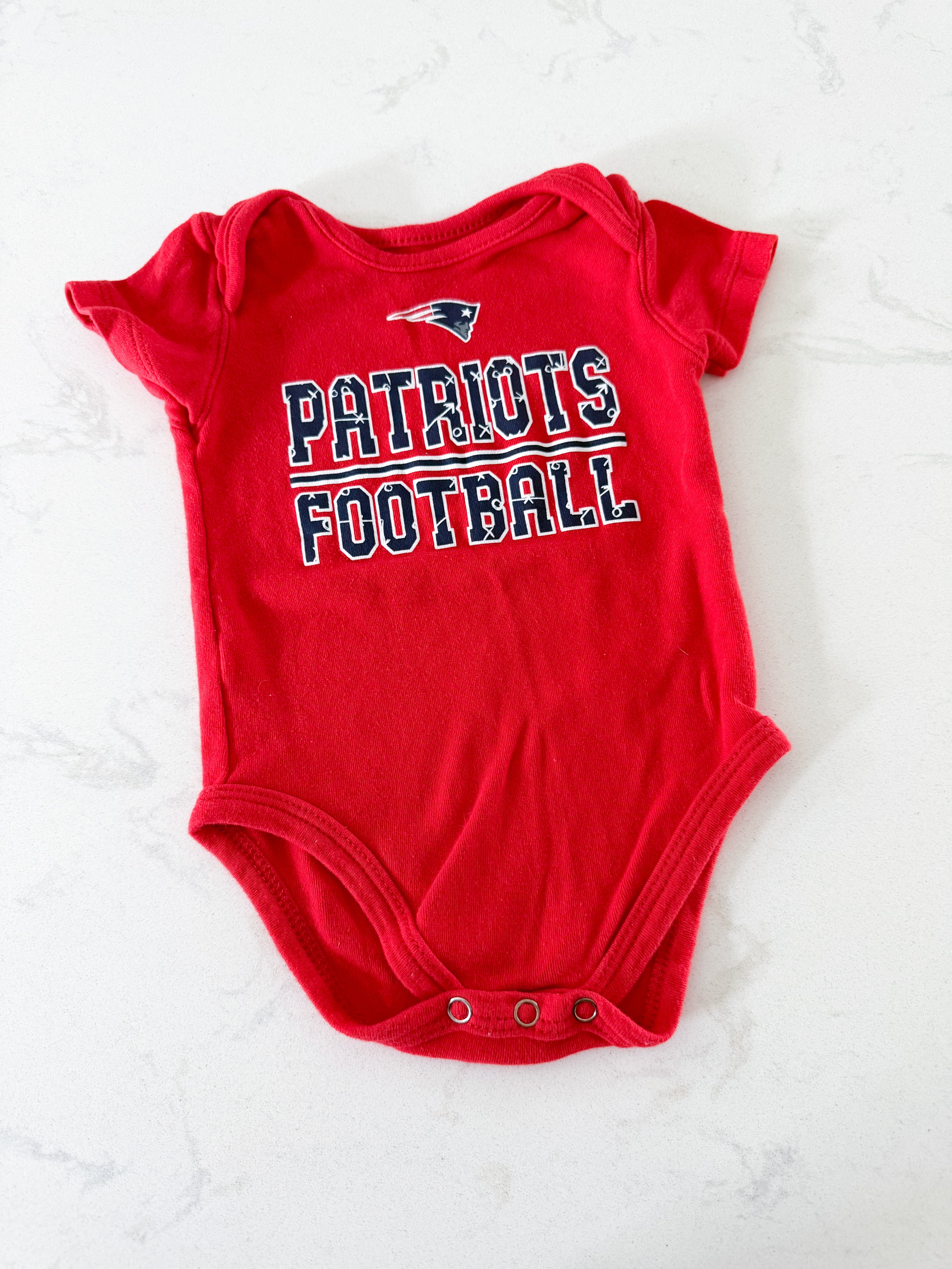 NFL- 3-6m- VGUC- red short sleeve bodysuit with patriots graphics