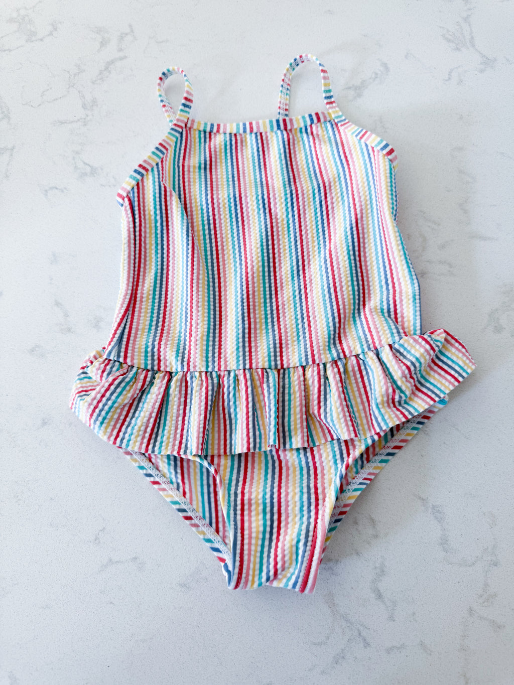 Primark- 12-18m- VGUC- rainbow coloured thin vertical striped swim suit with ruffle skirt
