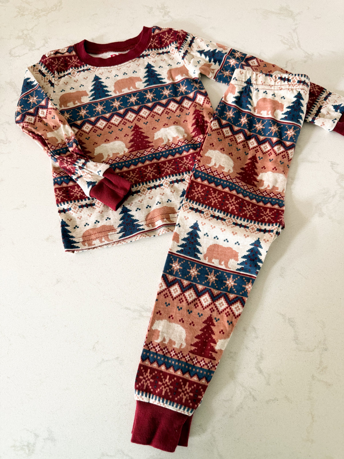 The Children’s Place- 6-12m- VGUC- burgundy white beige two piece long sleeve jammies with geometric patterns