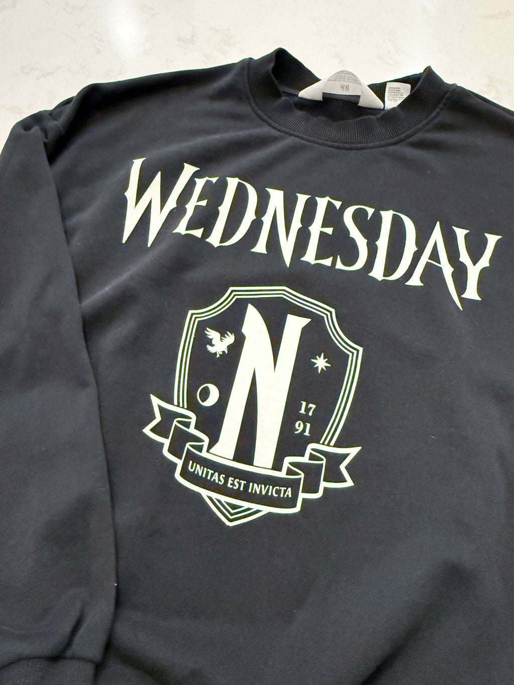 H&M- 12/14Y- VGUC- black crew neck sweater with Wednesday graphic