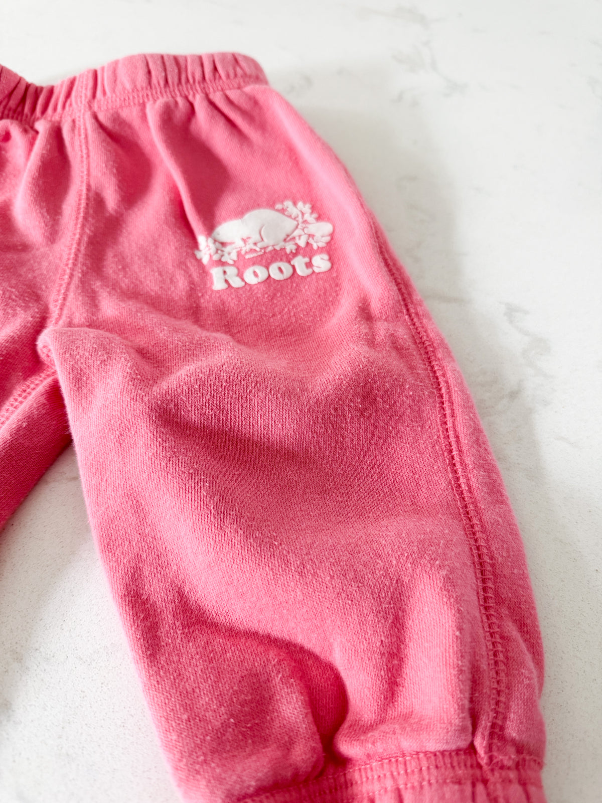 Roots- 6-12m- PLAY- bubblegum pink sweat pants with symbol
