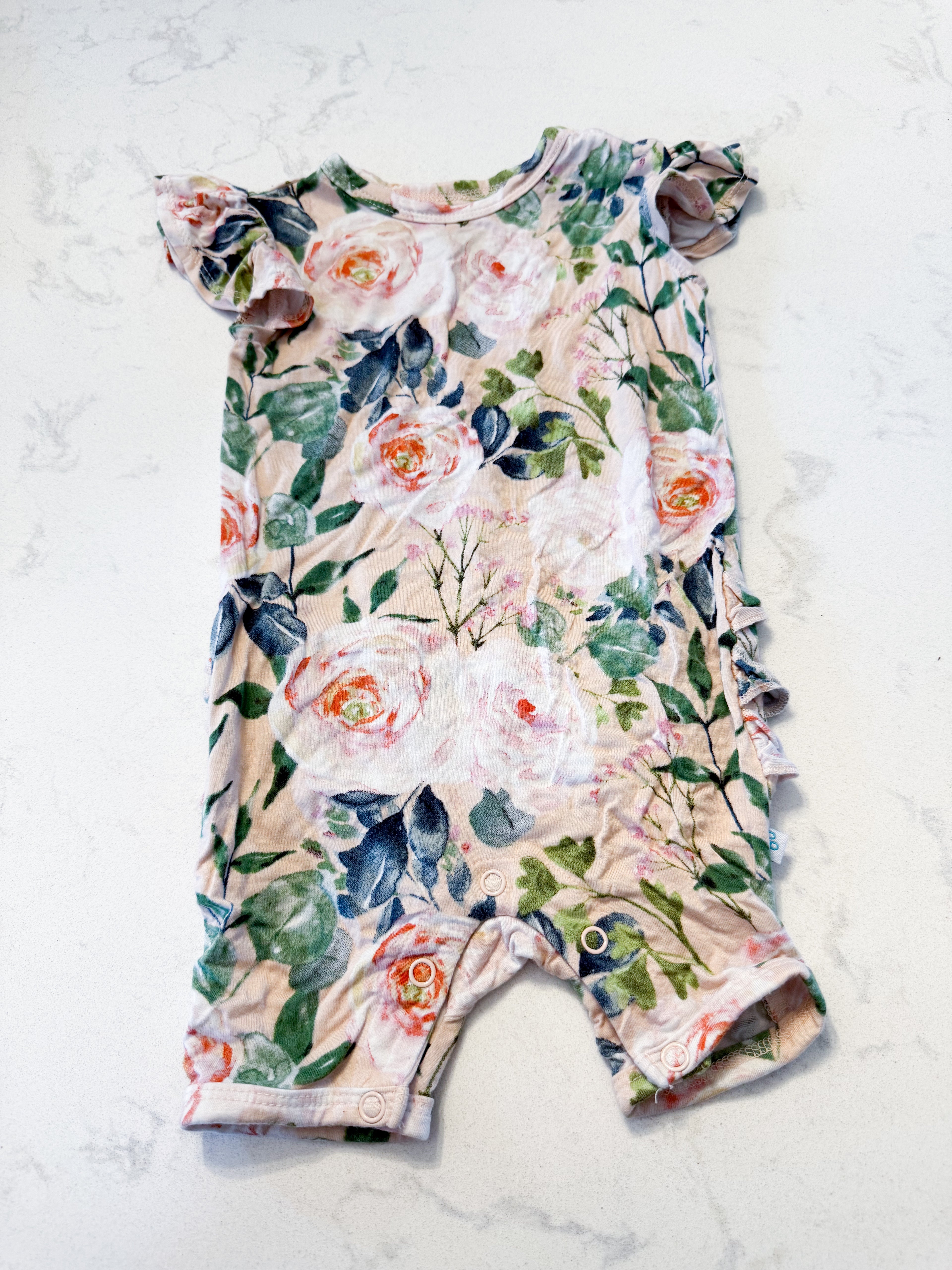 Posh Peanut- 3-6m- VGUC- light pink short sleeve bamboo romper with rose pattern and ruffle bum