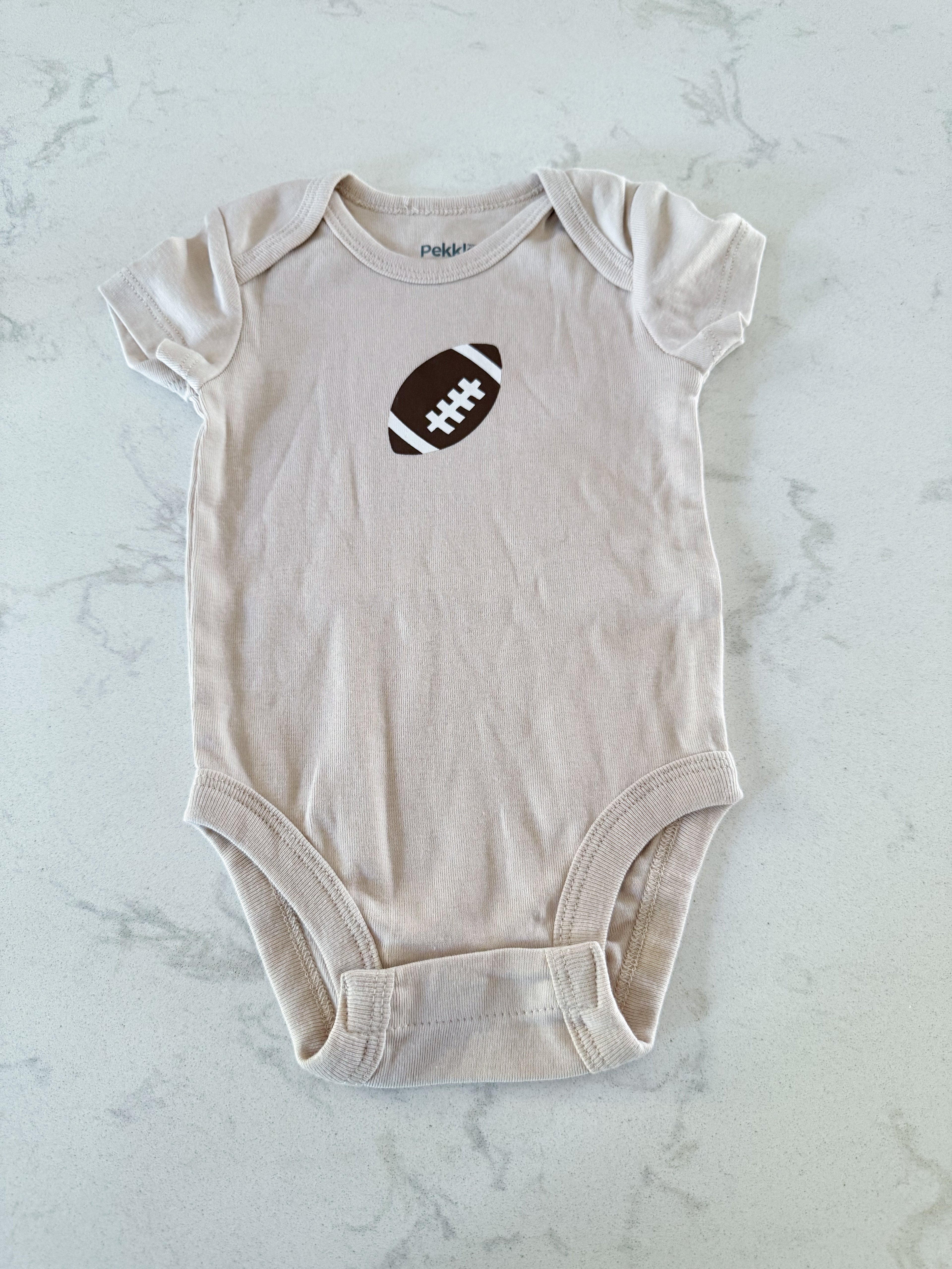 Pekkle-3m- VGUC- beige short sleeved onesie with football on front