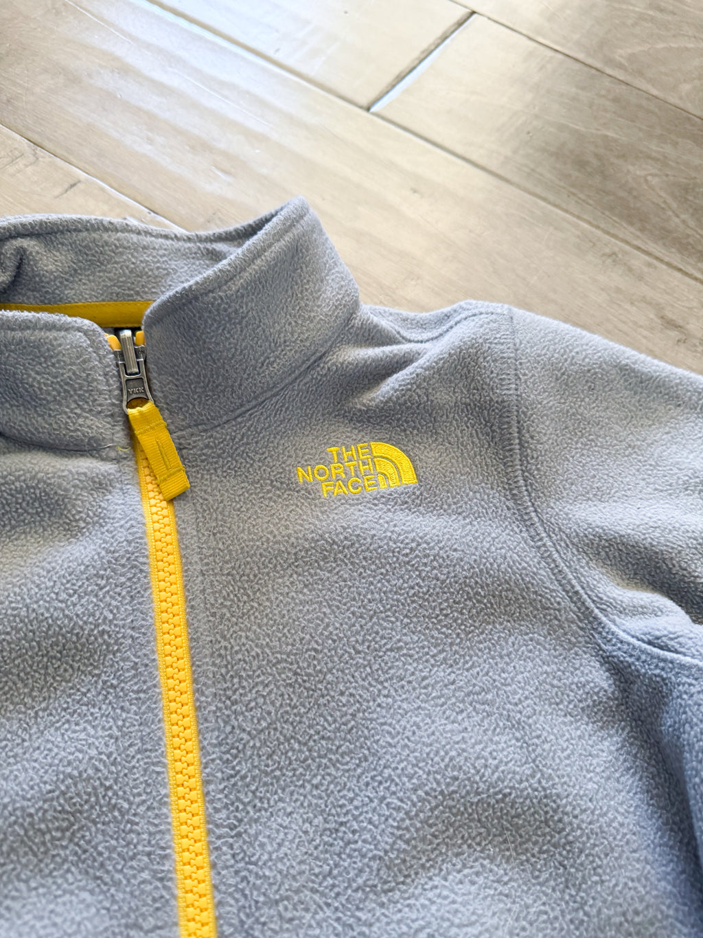 The North Face- 6Y- PLAY- Grey zip up fleece with yellow accents