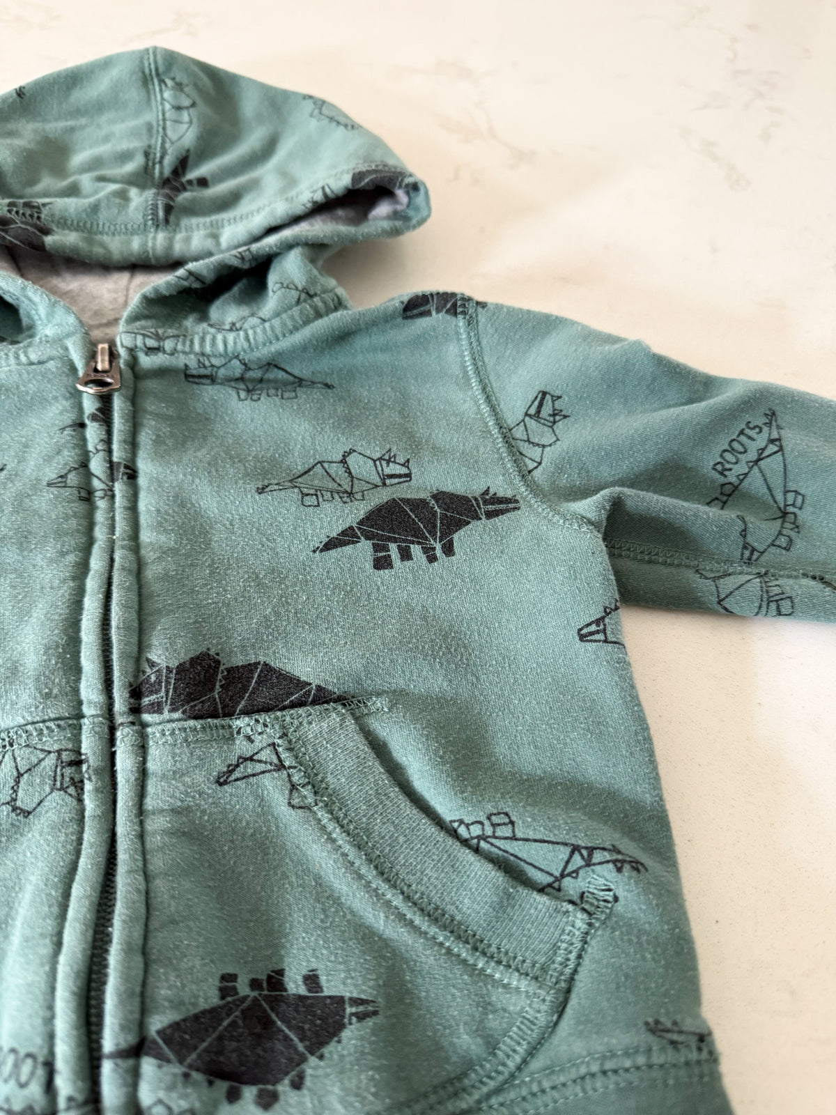 Roots- 6-12m- PLAY- green zip up geometric Dino hoodie