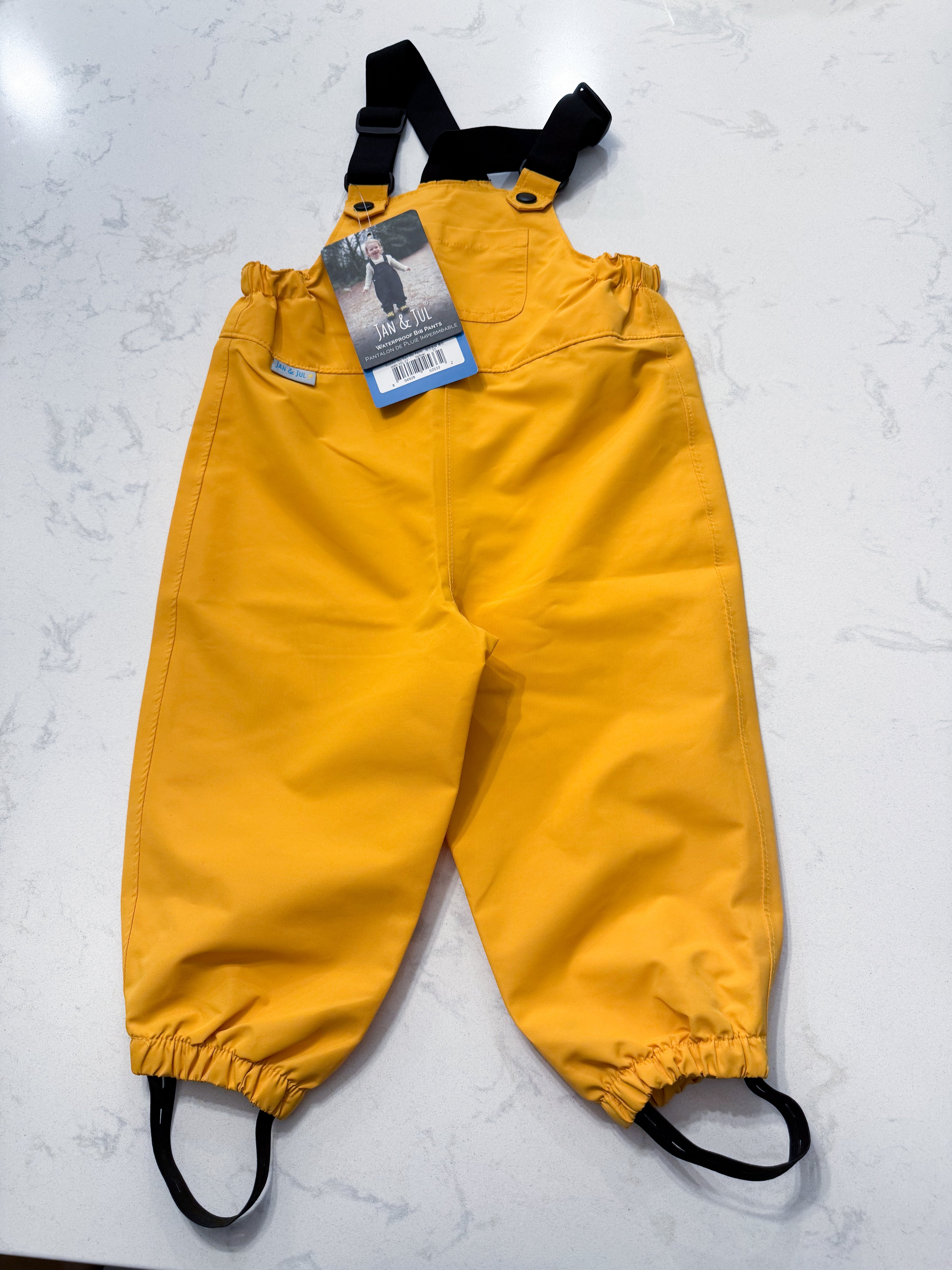 Jan and Jul- 1Y(fits 12-18m)- BNWT- yellow rain pants with shoulder straps