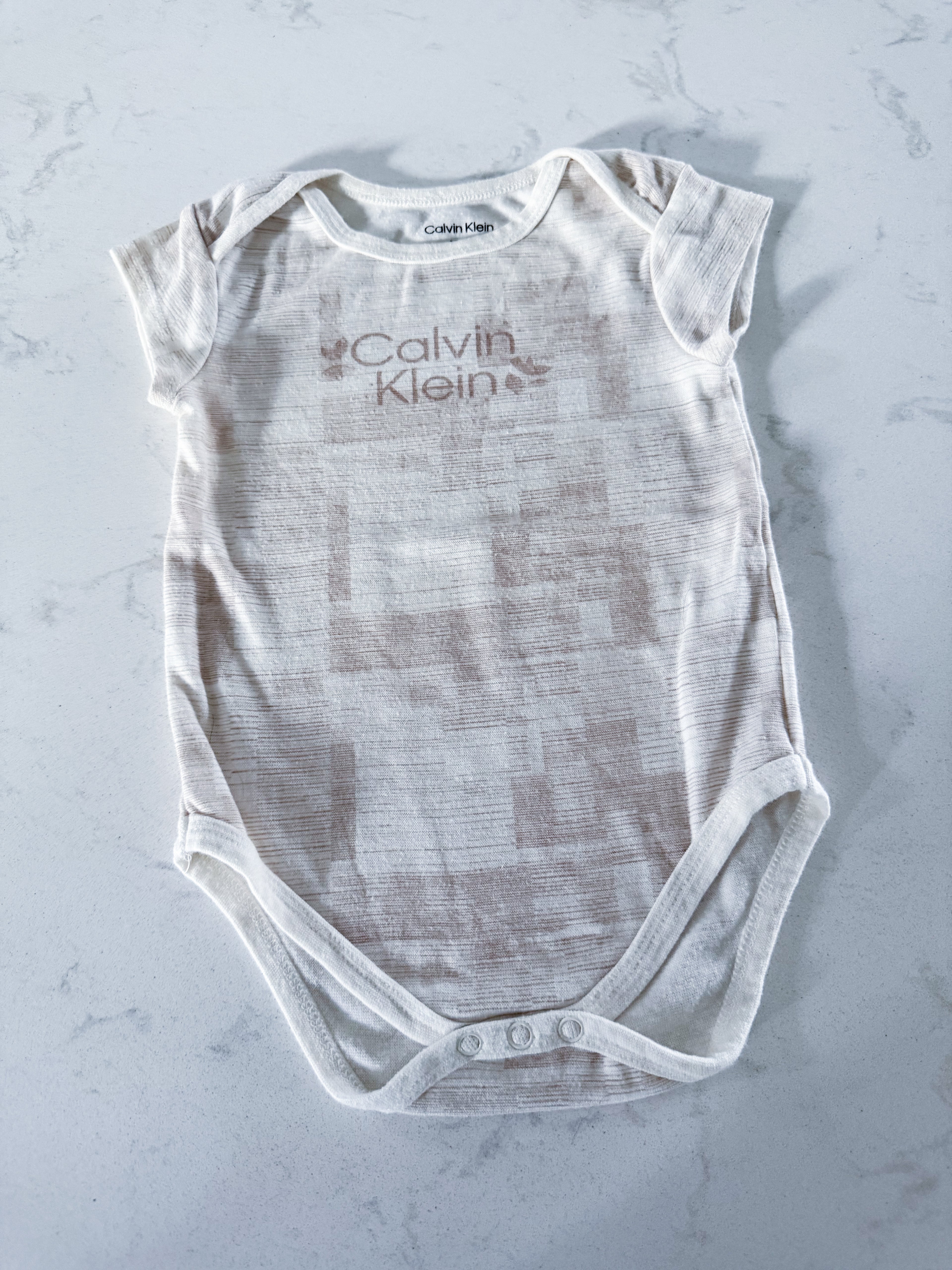 Calvin Klein- 18m- GUC- beige short sleeve bodysuit