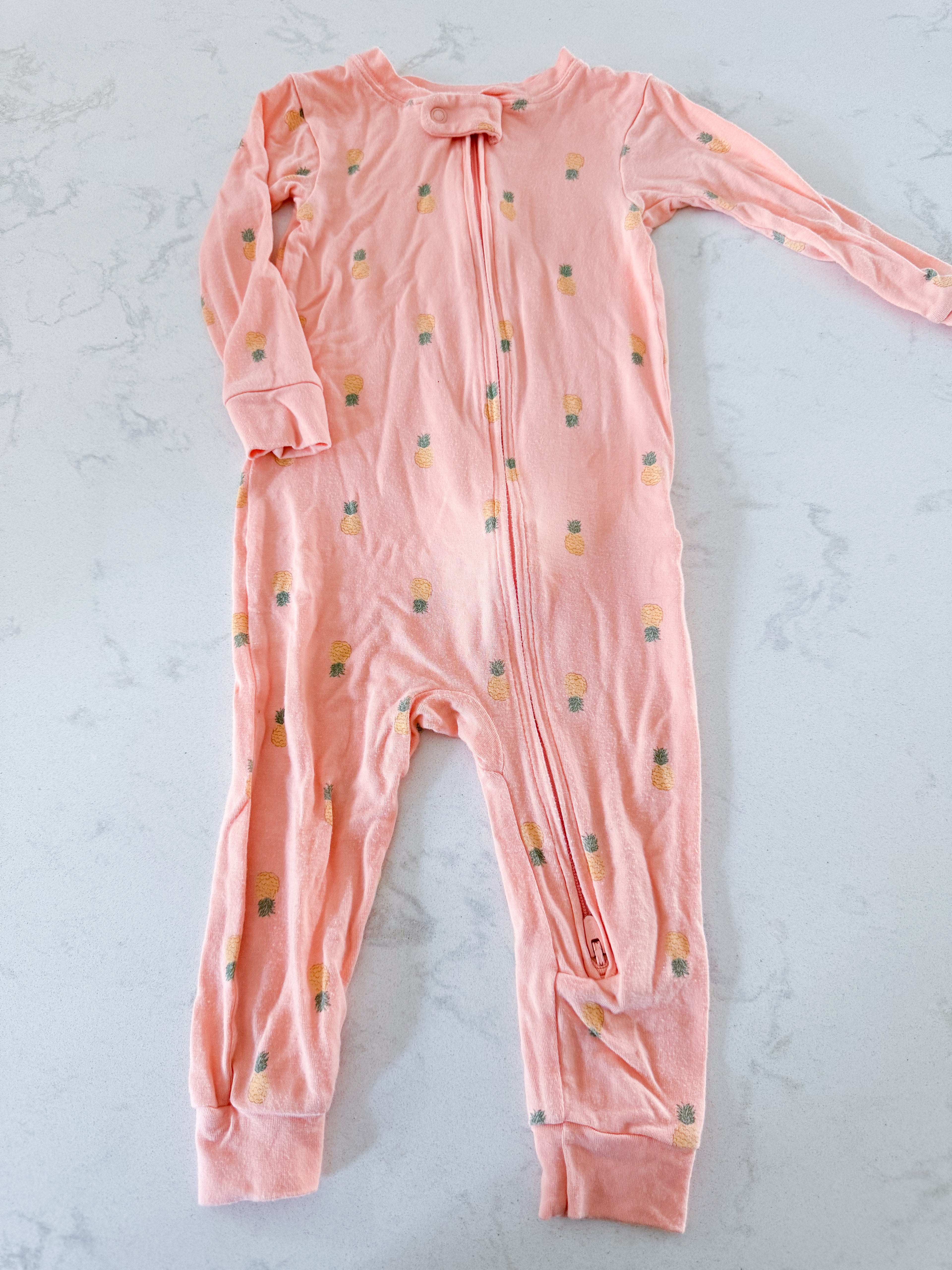 Purely soft by Carters- 12m- GUC- bright light orange with pineapple graphics. Bamboo like material