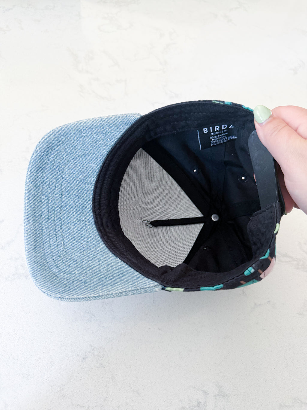 Birdz- 0-24m- GUC- black ball cap with blue brim and popsicle graphic